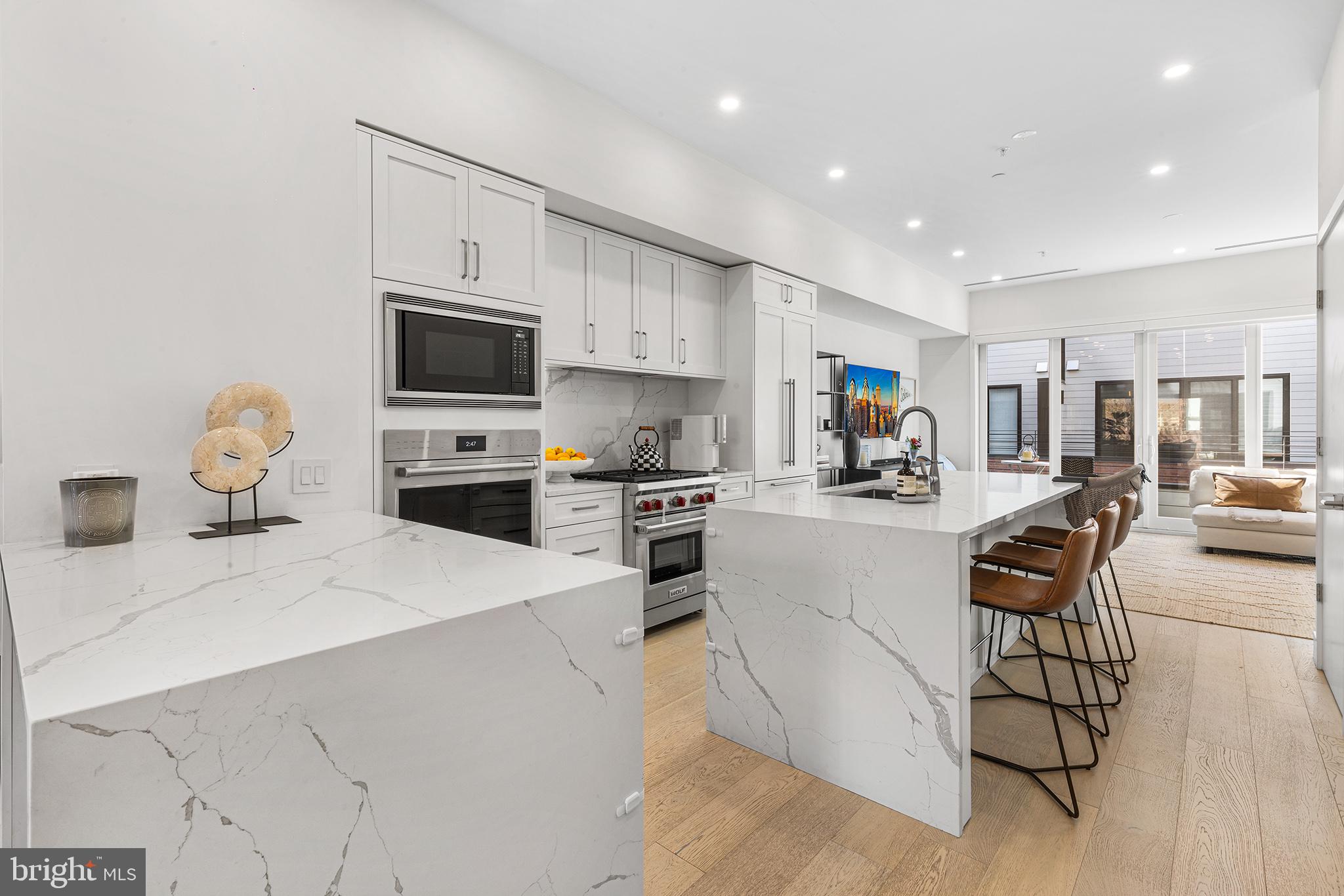 Discover luxury living at Logan23 in a home that has it all, located on quiet Croskey street in Logan Square, within the Albert M. Greenfield School catchment.
Enjoy stunning skyline views, a private 3-car garage, gated driveway, and tax abatement through 2032—an increasingly rare find. This 4-story residence features a 5-stop elevator, smart-home tech, three private outdoor spaces including a show-stopping roof deck with hot tub and outdoor television. Sub-Zero and Wolf appliances, quartz countertops, and custom cabinetry adorn the luxe kitchen The spacious living area opens to a private deck that’s great for grilling and entertaining. Bathrooms showcase designer tile, floating vanities, and curated fixtures, while wide-plank white oak floors run throughout.
The full-floor primary suite includes custom closets, a balcony, and a spa-style bath with soaking tub, spacious shower, and views of the city skyline. Additional features include multi-zone HVAC, Hunter Douglas window treatments, ensuite baths, exceptional storage, and high-end finishes throughout. Just steps from 30th Street Station, Giant Supermarket, The Fitler Club, Rittenhouse Square, and the Schuylkill River Trail, Logan23 offers unmatched luxury in an unbeatable location.