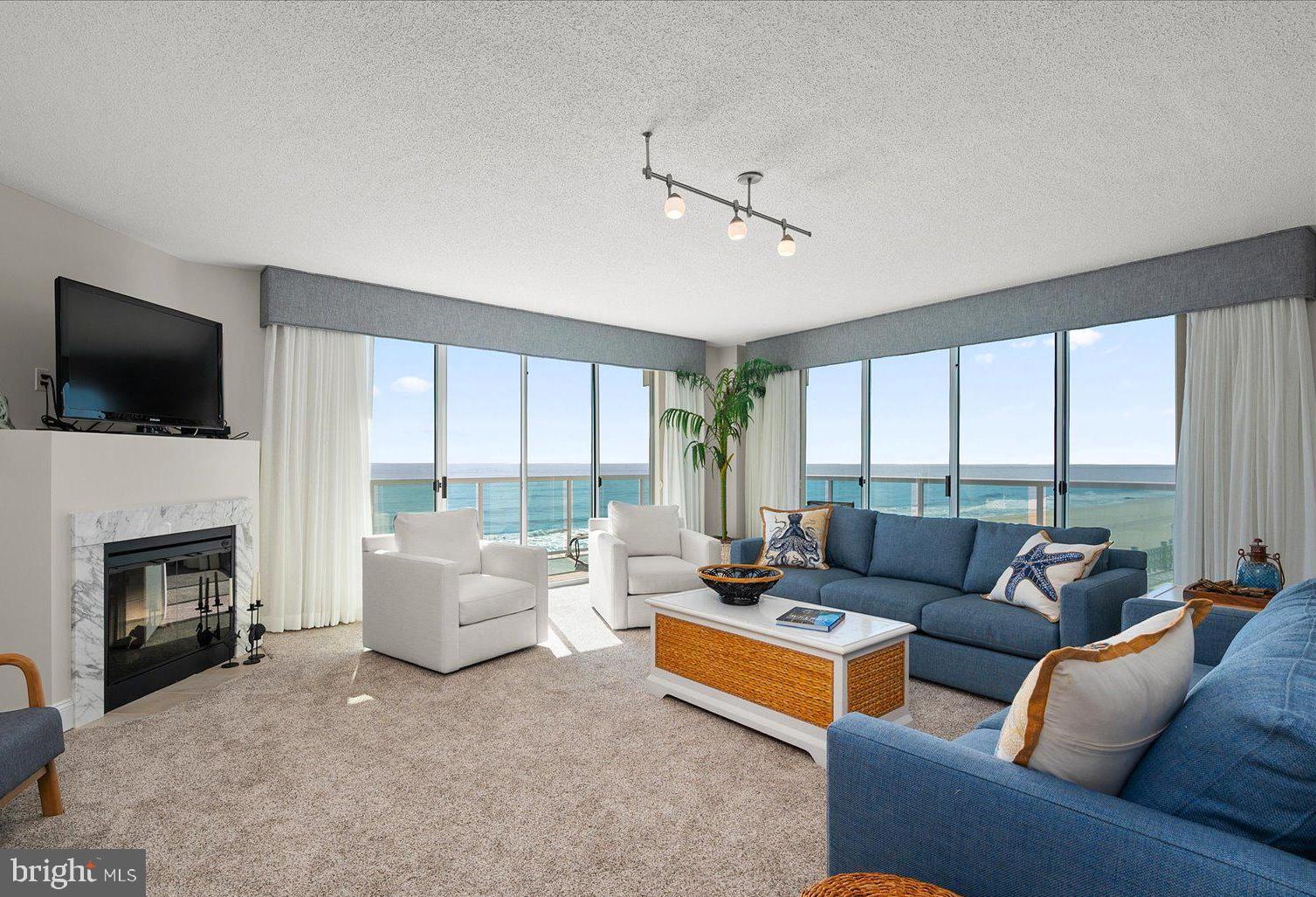 Welcome to 505 Miramar, the premier location in the private residences on the top floor of the Courtyard by Marriott. The fifth floor is exclusive to nine luxury condominiums, only three of which are direct oceanfront. Breathtaking ocean views can be enjoyed as soon as you enter this end-unit penthouse. Step outside to the huge oceanfront, wrap-around deck for the best panoramic beach and boardwalk views you'll find in Ocean City. The bright, open living room and dining room feature a fireplace, floor to ceiling windows and sliding glass doors. Open floor plan continues to the upgraded kitchen with granite countertops, barstool seating and of course bright blue ocean views. The primary bedroom has great southern exposure and additional deck with more beach views. Spacious primary bathroom includes a jetted soaking tub, stand-up shower and dual sink vanity. Built in 2009, this well maintained hotel/condo has amazing year round amenities; heated pool, fitness center, restaurant, 24 hr security, in-house management and maintenance. All of this with an incredibly low condo fee! This is truly a unique and rare opportunity to own a direct oceanfront penthouse on the famous Ocean City boardwalk.
