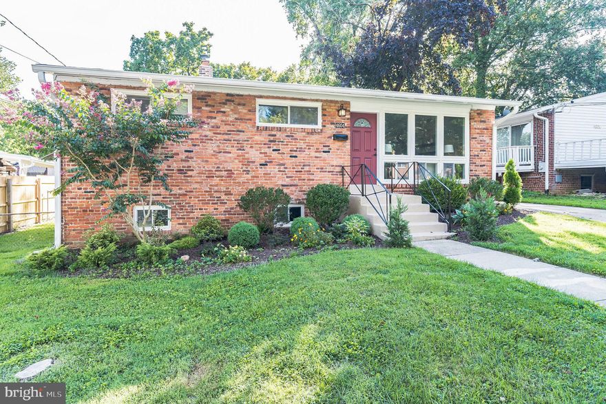 Welcome home to this beautiful, fully renovated brickfront Rambler in Wheaton Woods with 4 bedrooms, 2 bathrooms , 2,300 sq ft of space and .16 acres of land! Beautifully landscaped with foundational bushes, flowering trees, and shrubs, you'll instantly feel at home as you take the long walkway leading you to your brick red front door. Walk into a light and bright open space living room, with streams of light flowing through the floor to ceiling windows, and hardwood floors that flow throughout the main level. Stay warm and cozy with the mounted electric fireplace set in a stunning brick accent floor to ceiling buildout with mantel! Entertain guests easily in the dining room with a 4 light contemporary chandelier and a view that overlooks the outdoors. The spacious kitchen features all new cabinets, a sink that overlooks the living area, and all stainless steel appliances, including a triple door fridge with ice maker. Also features recessed lighting and a floor to ceiling cabinet pantry. Enjoy everyday meals on the breakfast bar that seats two! Three spacious bedrooms and a hall bath with combination tub and rain showerhead faucet complete the level. The basement is perfect for additional living space or rec rooms and includes new plush carpet, theater room complete with movie screen and projector, and the 4th bedroom plus full bath - perfect for guests staying over! Also features a tiled combination laundry and storage room that features a full size washer and dryer, an extra large rinse sink, and built in shelving. Take a break outdoors on your covered back porch overlooking your fully fenced in backyard - the perfect place for a summertime BBQ! Door leads to the kitchen and makes for easy grocery drop off. Conveniently located close to tons of shopping & restaurants -- Wheaton Mall, Pike & Rose, Rockville Town Center, and Kensingtons' Antique row. Access to most major highways & public transportation. Surrounded by an abundance of nature trails & parks; Rock Creek & Matthew Henson Park. You do not want to miss this one!