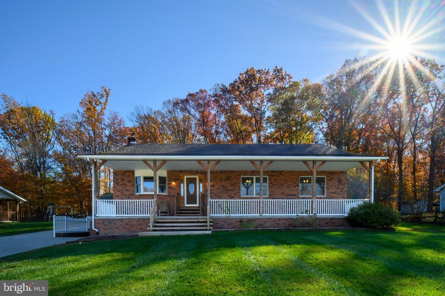 OPEN HOUSE CANCELED. Come and fall in love with this spacious rancher with a little something extra. The home has 3 nice sized bedrooms and 2 full baths, one is the primary bedroom with en-suite bathroom. A large open kitchen with lots of storage and counter space, and a room for a full size table. They're a large living room and 2 porches - front and back that run the length of the house. Plenty of space to sit outside and enjoy nature. There is even a ceiling fan on the back porch for those warmer days!  The lower level is perfect for a family room, with room for gaming tables, TV's., a bar, or anything you can think of. There is a wood burning stove that makes the whole home nice and toasty when it is cold outside.  The utility room is oversized and has the laundry, storage space. The oversized garage has parking for 2 vehicles with room for a work space. It has its own oil heating system, a 220 amp sub panel, and more. The garage was built with 2x6's to make sure it is going to last. There is a hot and cold water hose bib on the side of the house. New paint and trim and new carpet was installed in the lower level in 2023. Water purification system installed in 2019, Wood stove installed in 2021. New Refrigerator in 2021. Landscaping plant-boxes added in 2021.