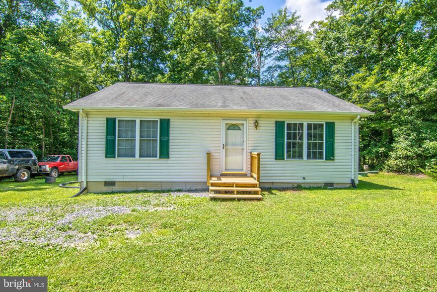 Are you a renter dreaming of home ownership? Or looking for something all on one level? This is the home for you! This gem offers spacious rooms and beautiful hard wood floors throughout. Lots of natural sunlight graces this home in every room. Living room with gas fireplace, country kitchen with lots of cabinet space, 2 bedrooms, 2 full baths, deck off the back to enjoy those summer nights watching the neighborhood wildlife. You may even meet the neighborhood squirrel! He is friendly and loves to be fed treats! Large storage shed conveys. This home is minutes from town but offers peace and quiet. Great home for a first time home buyer or the one level living buyer! If your renting, now is the time to buy! You can purchase this home for less than what you currently pay in rent! This home will not last long at this price so don't miss the opportunity to make your dream of home ownership come true! NOTE: SEE DOCUMENTS FOR ROAD PLANS. ROAD WILL BE PAVED IN THE NEAR FUTURE. PLEASE USE DIRECTIONS NOTED IN LISTING. GPS WILL TAKE YOU THE LONG WAY ON A GRAVEL ROAD.