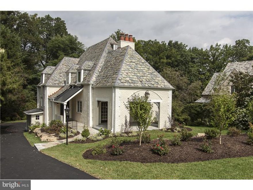 Stately Main Line residence renovated by Sposato Homes. Old world charm still prevails in this 5 bdr. 4.2 colonial home with a brand new interior. Complete with a Fabulous eat in kitchen, bar w/wine fridge, and adjoining breakfast and family area w/french doors that lead to an outside deck. Spacious living room with fireplace leads to a covered portico and an oversized dining room perfect for entertaining. Spectacular character is maintained throughout the home. The second floor Master bdr suite includes a luxurious master bath with an incredible walk in closet. 2nd bdr has a full private bath and 3rd and 4th bdr share a full hall bath. Fifth bdr is a large suite with a full bathroom and private access. The finished lower level has a stone fireplace, separate mudroom, half bath, and outside/garage access. Surrounding the home are exquisite English gardens and a beautiful backyard allowing you to feel nestled away in a private residence but yet located within minutes from everything the Main Line has to offer.