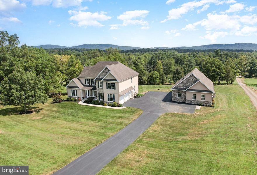 Offers Due 9/2 at 6pm.  This one has it all! Custom built 3,197 sq. ft. home with a large detached 40x30 3-story garage situated on a premium 2.26 acres in the desirable Stonehedge Estates. This move-in-ready home features a bright and inviting foyer with an expansive main floor perfect for entertaining family and friends. The main floor features a formal dining room, large eat-in kitchen with ample cabinetry and countertop space, a cozy breakfast nook, a spacious two-story great room with a gorgeous floor to ceiling stone fireplace, main floor office, bonus room, full and half bathroom, laundry, and so much more! The second story features a large owner's suite with an ensuite bath with new luxury vinyl flooring, double sinks, and separate soaking tub. The second floor also features two additional bedrooms with a connecting jack and jill bathroom. The lower level is unfinished providing space for storage and boasts a walkout door, windows, and a rough-in for a full bathroom offering a great opportunity to add even more living space in the future. The large, detached garage offers even more storage space and is the perfect spot for your cars, tools, and hobbies. Outdoors features a rear deck and patio perfect for entertaining and taking in the views and a large lot ready for outdoor enjoyment. This property also offers a unique opportunity with a 2.41 acre lot for sale adjacent to this property. Please see MLS #PAYK2067794. Northern York School District and located just minutes from Gifford Pinchot State Park, Roundtop Mountain Resort, and centrally located close to shops, dining, and easy access to Gettysburg, Harrisburg, and York. Contact to schedule your private tour today and you could be calling this gorgeous house your home in no-time!
