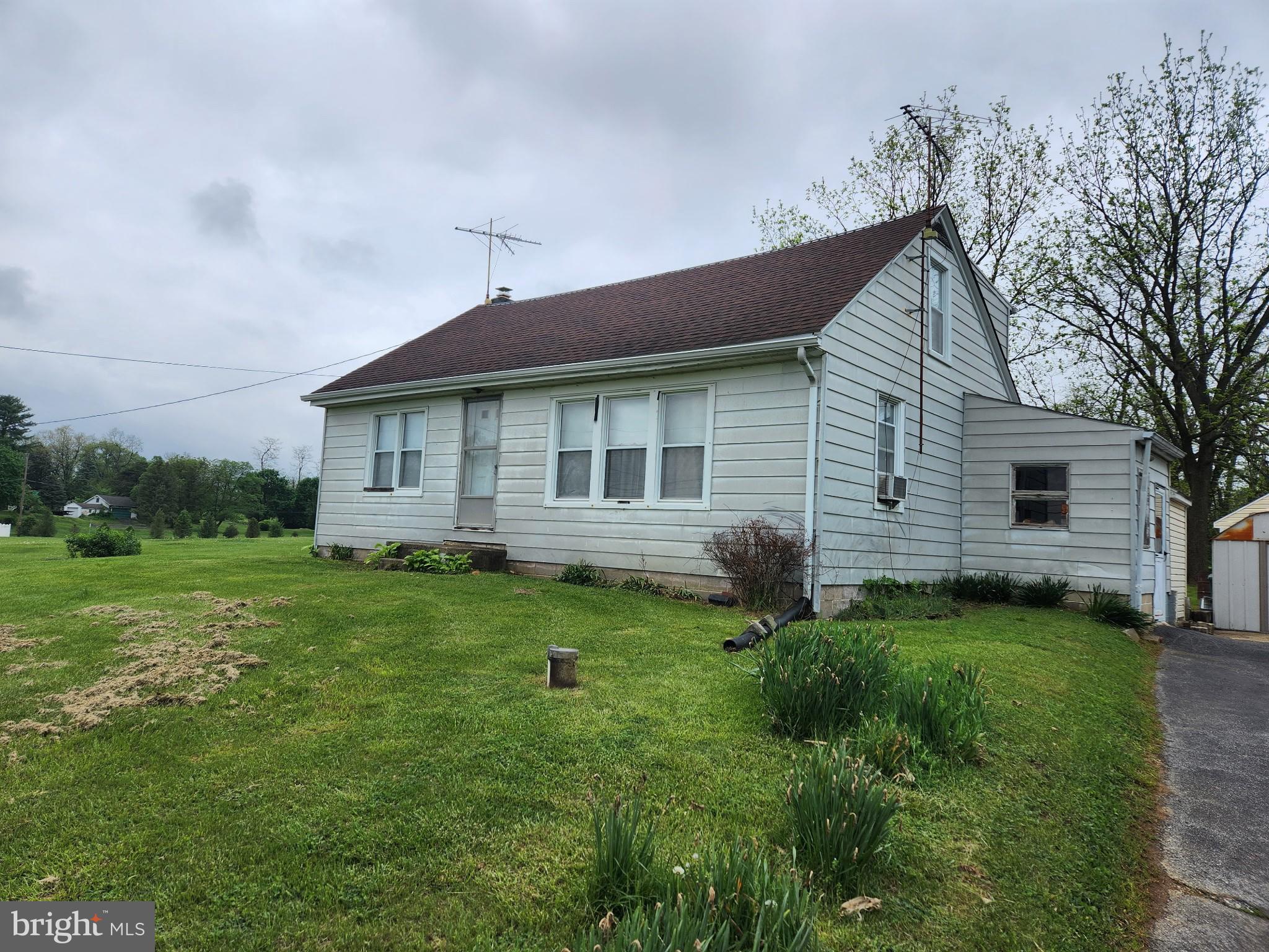 OFFER DEADLINE 5/9 AT NOON. Opportunity awaits this four-bedroom Cape Cod located along scenic Petersburg Road in South Middleton Township. Situated on a spacious double lot totaling 0.92 acres, this property offers amazing countryside views. This quiet, rural location is just minutes from Downtown Carlisle, I-81, and South Middleton schools. The home is in need of cosmetic updates but offers great potential. Four bedrooms, one full bathroom, living room, kitchen, and full unfinished basement. Nice level yard with several outbuildings. Price includes the adjoining lot.