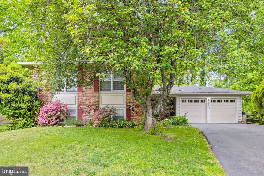 *Seller has VA loan at 3.625% which can be assumed, please check with lender for details* Beautiful split-level, single-family home on a peaceful, tree-lined cul de sac in the scenic Longwood Knolls.  Boasting over 2,700 square feet of living space and hardwood floors throughout, this home is sure to exceed your expectations. The main level features three bedrooms and two full bathrooms, including the spacious master suite with a walk-in closet. Enjoy family dinners in the formal dining room and movie nights cuddled up in the living room. On the lower level you'll find an additional bedroom and full bathroom. The expansive family room is complete with a cozy brick fireplace, the ideal place to relax and unwind. Bonus room can serve as a home office and boasts built-in bookshelves for easy storage. The lower level is equipped with a radon mitigation system for peace of mind. Additional functional upgrades include HVAC (2014) and Water Heater (2022). Surrounded by lush greenery on a 1/3 acre lot, enjoy plenty of space to relax and enjoy the outdoors. The rear patio is backed by a private, fully fenced yard with endless potential for outdoor recreation - trampoline, garden, pool and more. Perfect location just off the Fairfax County Parkway and less than a mile away from Burke Lake Park and South Run Community Center.  Excellent Fairfax County schools. Centrally located with fast, easy commuter routes to Pentagon ( 30 min -- slug, express buses, VRE, or metro) and to Fort Belvoir, or NRO.  Close to Sydenstricker, Gambrill, and Rolling Valley Park-n-Rides. Welcome home! *No Rent Back Needed*Motivated, Bring ALL Offers*