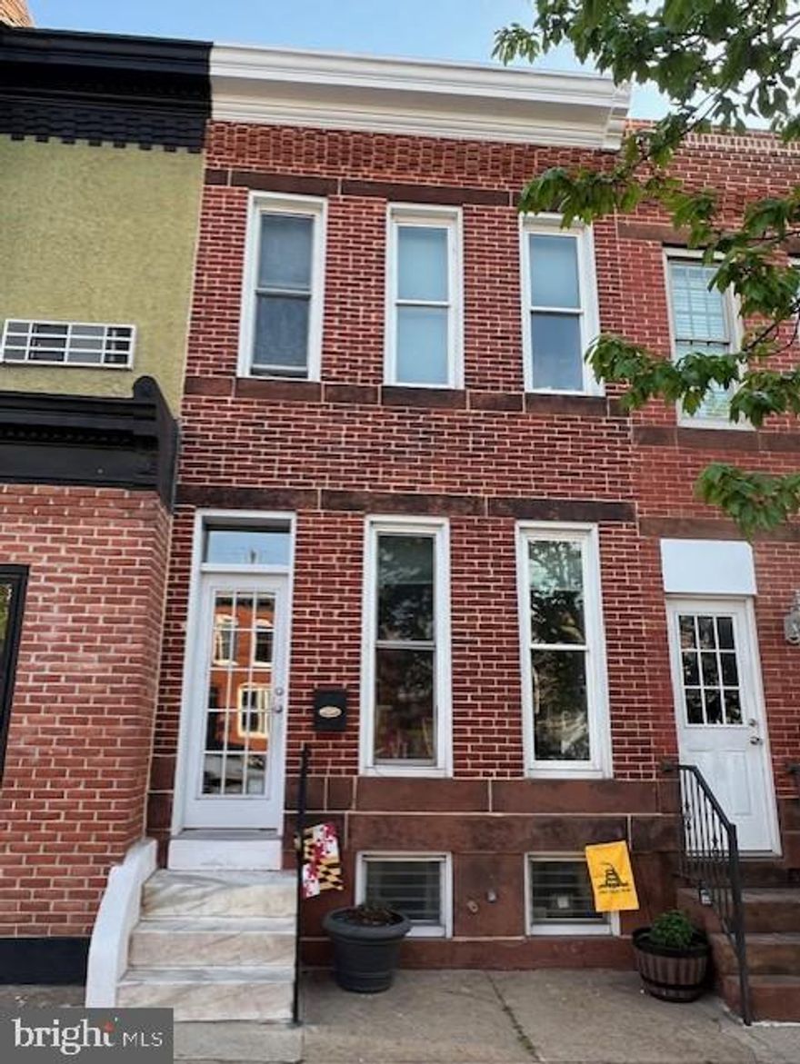 Historic Federal Hill thoughtfully and completely remodeled while preserving its character. This light filled property features exposed brick, soaring ceilings with exposed beams, fresh paint and a spacious layout designed for modern living. 
The updated kitchen showcases tile flooring, a stylish backsplash, and new appliances blending classic charms with contemporary conveniences. Major systems have been recently upgraded, including HVAC 2 years, water heater 1 year old and a $1700 reverse osmosis water filter in the kitchen. The expansive primary suite off a huge walk in closet and abundant natural light. The updated bath add comfort and style.  The new rear deck is perfect for entertaining. 
Additional highlights include a versatile lower-level office space and prime location to shopping, dining, and all the conveniences of downtown living.  A short walk has you at the inner harbor. Imagine watching the fireworks from your home. 
A rare opportunity to own a beautiful, restored home in one of the city's most desirable neighborhoods.