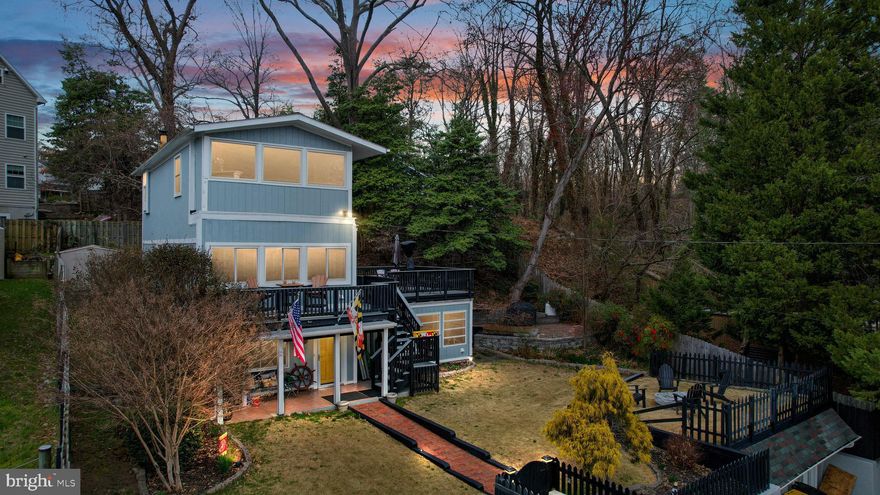 ATTENTION!!! Buyer financing fell through.  Previous contract was a home sale contingency that did NOT perform.
This is it!  Do not miss this rare opportunity to own a very unique water view/privileged contemporary home, in the desirable Carrollton Manor neighborhood of Severna Park. This amazing home features 3 bedrooms and 2 full bathrooms with multiple decks perfect for entertaining or quietly enjoying the peace and tranquility of the water view on the Severn River. This beautiful 2240sq ft home boasts three floors that have been remodeled top to bottom. Recent updates include a new roof from Long Roof, new Thompson Creek windows, beautiful White Oak flooring throughout, an updated electrical panel, LG stackable steam washer & dryer, two drawer dishwasher from Fisher Paykel, KitchenAid stainless steel fridge, gleaming granite countertops, all new cabinetry accented in antique white, and a gorgeous Viking double oven and six burner gas stove to round out the tastefully renovated kitchen.  The main level entry also affords a spacious dining room, den/study with cozy pellet stove and rustic Pennsylvania Barnwood accented walls and tin ceiling, and possible 3rd bedroom/ Office. The primary suite is situated on the third floor with a large open floor plan with sitting area, sprawling bathroom with authentic barndoors, double vanity, refinished 1932 American Standard tub, walk-in closet and loft for an amazing panoramic view of the Severn River. The 2nd level is where you will find the large second bedroom, completely updated full bath and family room with wood burning fireplace, which leads out to a private maintenance free deck with amazing views of the sunrise and sunset on the outdoor terrace and balcony which overlooks the professionally manicured Zoysia Farm grass. For the outdoor enthusiast, this is a hidden gem within a water-oriented neighborhood that has a new community clubhouse, kayak storage, multiple beaches, large pier, multiple boat slips, and beach volleyball. The home is situated on 3 lots being sold as one parcel. The list on this amazing water view home goes on and on... You are literally just feet from the beach and water!!
Do not hesitate on this one and schedule your private tour today!