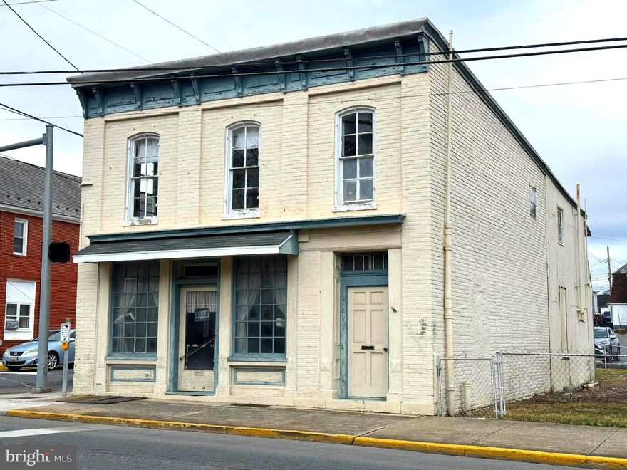 **561/563 N Queen Street – Exceptional Multi-Unit Building for Sale!**

Don’t miss out on the incredible opportunity to own this charming 2-story commercial building located at the vibrant corner of N Queen Street and Pennsylvania Avenue. Ideally situated just across from the brand-new medical manufacturing center, this property is positioned for future growth and development – making it an unbeatable investment!

The first floor offers an expansive showroom space, perfect for retail or any business venture, with a versatile area at the rear that can be customized for your needs. A convenient half bath on the main level and access to a basement add practicality to this already desirable layout. 

The second floor features a spacious 2-bedroom, 1-bath apartment, complete with a cozy rear sleeping porch for extra relaxation and living space. This versatile building is ready for your personal touch and offers the potential to create a truly standout property.

Set on a large lot with plenty of room to expand, this property is ideal for entrepreneurs, investors, or anyone looking to build equity with a little TLC. With some effort and creativity, this space can easily transform into the perfect commercial or residential gem. 

A bright future awaits at **561/563 N Queen Street**—don’t let this fantastic opportunity pass you by!