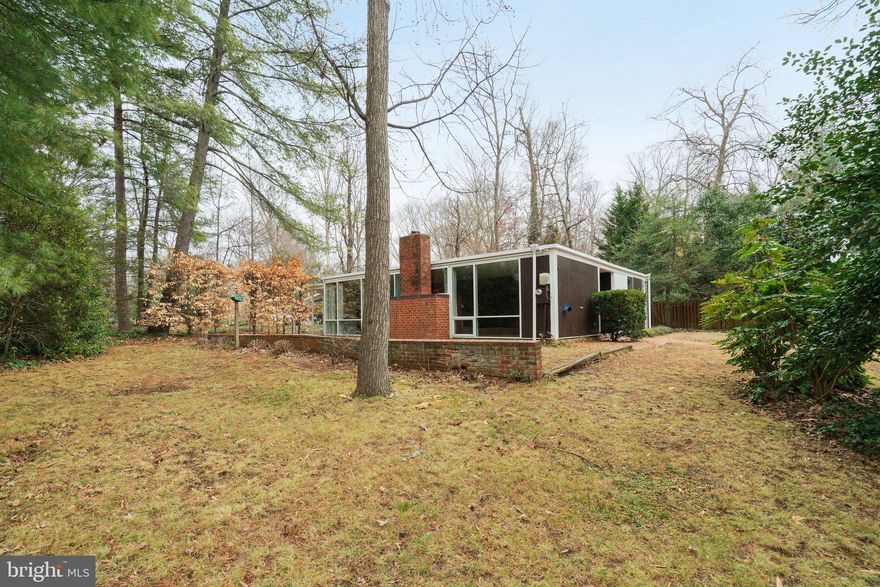 OFFERS DUE BY TUES 3/10 at 7PM. This expanded one-level Unit 57 Goodman home has been a long-term rental and is ready for its next chapter. Set on a corner lot surrounded by mature trees, the home has the signature glass, brick, and indoor-outdoor connection that defines Hollin Hills’ timeless mid-century modern style. The layout includes three bedrooms and two full baths, plus an addition that creates a flexible bonus room perfect for a recreation room, office, studio, or guest space, with extra storage. Walls of windows bring in natural light, and the easy single-level design offers great flow and everyday livability.

The property is being sold as-is. The price reflects the need for improvements, but the bones, setting, and footprint provide a strong starting point for renovation. For buyers ready to roll up their sleeves, this is a chance to restore and personalize a classic Hollin Hills home and build long-term value in a beloved neighborhood.