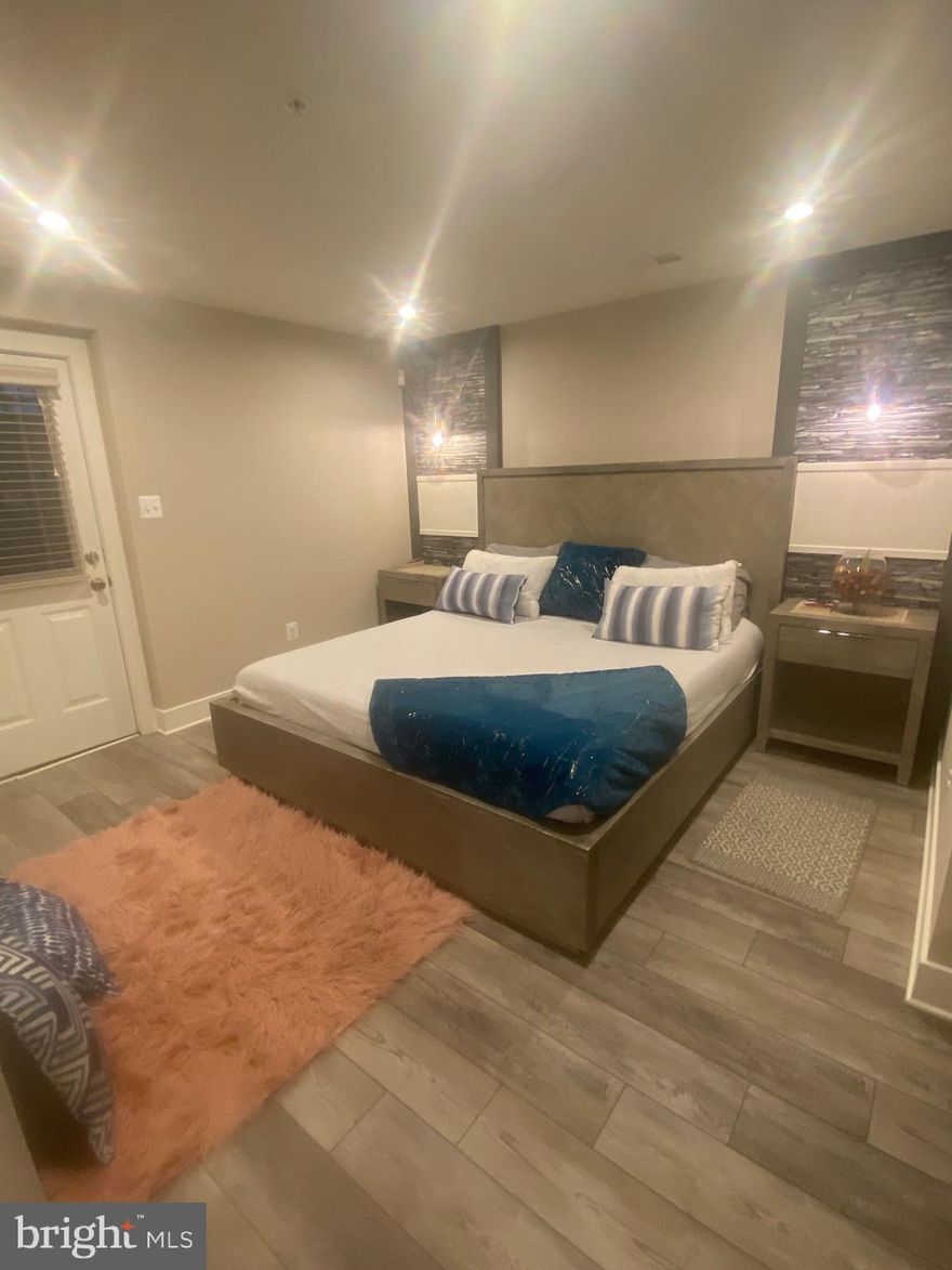 Beautiful and spacious lower-level 1 bedroom APARTMENT offers a lush and plush vibe.  This well-maintained home, within in a home, provides a separate living space, with private entrance, that comes completely furnished with exquisite home decor.   Utility and Water are assessed a $60 per month fee, in addition to the rent.  The kitchen boasts of granite countertops showcased by pendant lights. The owner will provide a new countertop cooktop and refrigerator.  Wash and Fold laundry service is provided.  This lovely home is near Arundel Mills Mall, and offers ease of access to beltways 97, 695, and I 95.  You will absolutely love it here. Call today to arrand a tour and be home before the holidays.