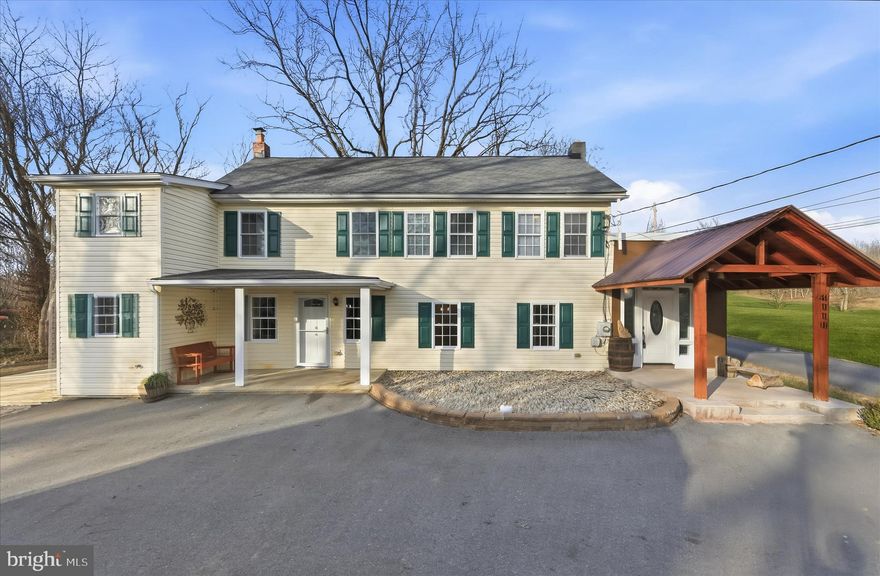 Beautifully updated Carriage House set on a premium half-acre lot, offering a rare blend of modern updates and charming country appeal. Extensive improvements include the kitchen, baths, entry and foyer, flooring, filtration system, appliances, lighting, hardwoods, carpet, paver stone patio, deck, chicken coops, and so much more.  A stunning wood-detailed covered entrance welcomes you into the new foyer and versatile flex room, accented by stylish tile flooring. The open floor plan features gleaming hardwood floors, a custom wall-mounted electric fireplace with an elegant marble tile surround, and a statement chandelier, creating a warm yet sophisticated living space. The spacious kitchen is equipped with granite countertops, stainless steel appliances, and a bright breakfast area, while the adjacent laundry room offers convenient outdoor access.  Upstairs, the generous primary bedroom suite includes a beautifully remodeled bathroom. Two additional bedrooms with new carpet and an updated hall bath complete the upper level. Outdoors, enjoy a large, private yard with a new deck and paver stone patio, chicken coops, and a sizable storage shed, perfect for relaxing, entertaining, or hobby farming.  Ideally located to provide peaceful privacy while remaining close to major commuter routes, shopping, dining, and entertainment, this exceptional property offers the best of both worlds.