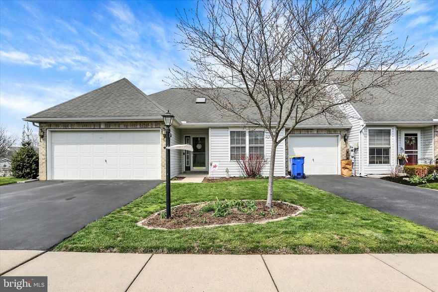 Enjoy easy one-story living in the highly desirable Evergreen community, known for its expansive green space, sidewalks, and scenic walking trails. This well-maintained home showcases numerous updates, including a fully remodeled kitchen featuring soft-close cabinetry, quartz countertops, tile backsplash, a gas range with double oven, and a peninsula perfect for morning coffee while overlooking the beautifully landscaped yard.  Fresh, neutral décor and recently painted interiors create a bright, welcoming feel, while new luxury vinyl plank flooring flows seamlessly throughout the home. The vaulted ceilings in the living and dining areas fill the space with natural light, enhancing the open and airy layout. The updated primary bath offers a walk-in shower and new vanity, and energy-efficient gas heat ensures year-round comfort. All appliances convey for added convenience, including a high-end washer & dryer.  Step outside to a covered paver patio—ideal for relaxing or entertaining in any weather. The fenced yard provides privacy and is perfect for pets, surrounded by thoughtfully designed native and flowering landscaping that creates a peaceful retreat. Enjoy views of the expansive common green space to the rear, as well as a mountain range in the distance.   Conveniently located near everyday amenities with easy access to major highways, this home is situated in Silver Spring Township and offers the added benefit of low taxes and minimal HOA fees.