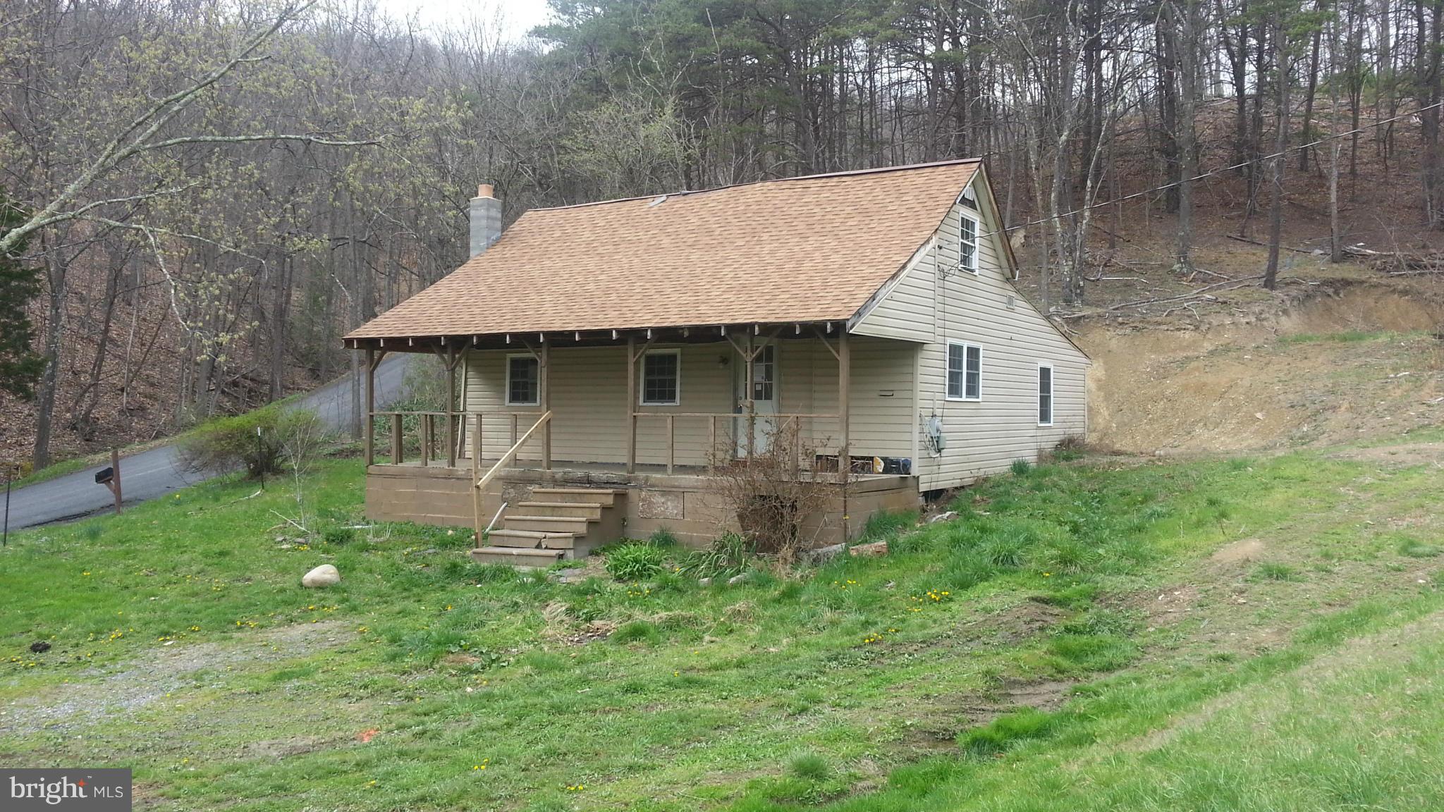 11 acres of unrestricted land fronting along county maintained Parrill Hollow Rd. Home is being sold as is and needs lots and lots of TLC. Would make a great do it yourself project. Handyman's special! this is a Fannie Mae homepath property