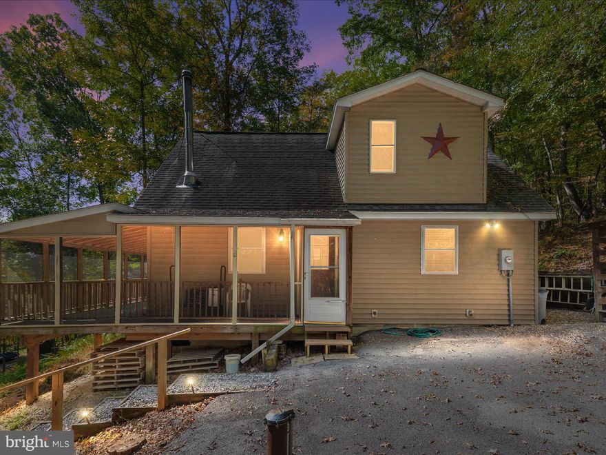 CABIN ADJOINING COVETED GEORGE WASHINGTON NATIONAL FOREST

What better place to escape the city lights and sounds then a beautiful cabin tucked into the mountains of West Virginia. This home offers the opportunity for full time living, weekend cabin, hunting retreat or investment potential with a short term rental.

The Location
Land is always sought after adjoining the National Forest and this property does just that. Whether you are looking to hike through the mountains or hunt just feet from the backyard the property offers just that. Successful hunts have been documented by the sellers with antlers in the garage and an impressive 17 point buck on the wall that come off the very ground this cabin adjoins. Just up the road a short distance is the Trout Pond Campground and Rockcliff Lake that is a major attraction and fantastic place to go fishing.

The Outside Features
Once you pull up to the gate you immediately notice that the sellers cut no corners and poured their heart and soul into this home. From Wild Turkey Ridge the driveway has been paved right to the steps of the porch. At the edge of the driveway sits a spacious garage with ample storage underneath that is fully enclosed. From the porch you will overlook a large area that has a large fire pit. This is a perfect location to burn marshmallows, cook hotdogs or feel the heat from a fire on a cool summer evening. To the right of the driveway is a large gravel area that has been leveled and offers a great location for additional parking. In this same location is a large wooden shooting backstop.

The Cabin
 Once in the cabin you notice that the sellers were meticulous with care over the years. Large bay windows  allow sunlight to naturally light the room with the ability to close the blinds. In the living room sits a wood stove that will heat the entire cabin with ease from the very wood that has been cut from the property. Down the hallway you will find a full bath with two spacious bedrooms. Just across from the kitchen is a laundry room and utilities will convey with the sale. Up the steps is another large bedroom with a full bath offering ample space for all guests, friends or family.

On Wild Turkey Ridge there are three AirBnB homes. These three homes can be viewed on their website to get a general idea for the investment potential this cabin holds as well.