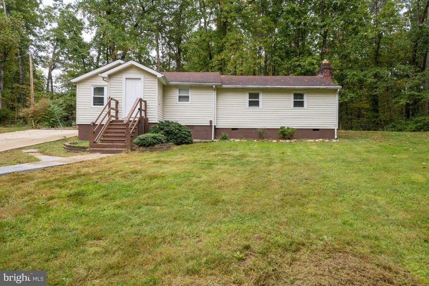 LOCATION! LOCATION! LOCATION! Minutes from the Back gate of Quantico Marine Base! Large private, wooded lot in sought-after Lake Arrowhead subdivision, just seconds off of 610. Poured concrete driveway, roof less than 10 years old. Spacious family room with a fireplace and sliding glass doors leading to the back patio. The potential in this home is outstanding!