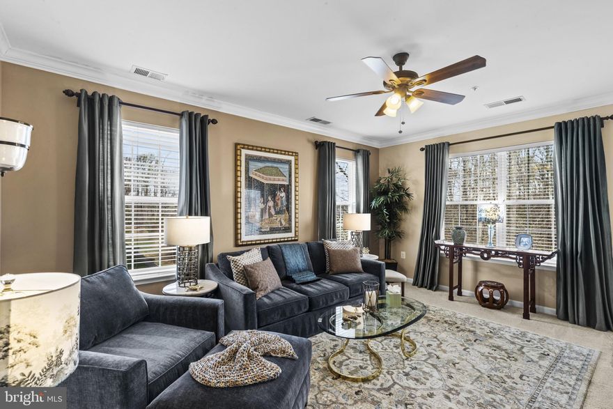 Luxurious 55+ Living: Serene 3-Bedroom 2-Bath Condo in Caroll’s Creek. Welcome to sophisticated over-55 living in this meticulously maintained 3rd floor condo, perfectly positioned to embrace nature's tranquility while remaining conveniently close to all essential services. This thoughtfully designed residence combines modern elegance with practical comfort, ideal for active adults seeking an easy maintenance lifestyle with great access to shopping, dining, and healthcare. Inside you will find the gourmet kitchen to be a chef's delight, showcasing premium GE Profile stainless steel appliances that blend style with functionality. Ample counter space and quality finishes make meal preparation a pleasure. An adjoining dining room provides the perfect setting for entertaining family and friends, with seamless flow from kitchen to table. The bright, naturally lit living room creates an inviting atmosphere perfect for entertaining. Additional conveniences include in-unit laundry and dedicated storage room for seasonal items and belongings. The Primary Suite is luxuriously appointed with a spa-inspired ensuite bath featuring a separate soaking tub and walk-in shower, your own personal sanctuary. There are also 2 secondary bedrooms, providing 2 additional spacious and versatile rooms perfect for guests, hobbies, or home office needs. Your private balcony overlooks peaceful woods, providing a serene retreat to enjoy morning coffee or evening relaxation. This vibrant 55+ community also offers exceptional lifestyle benefits: Resort-style clubhouse with heated pool, fully equipped fitness center, social meeting and game rooms for community connection, outdoor patio with grills for entertaining and a scenic pond and nature walking trails. The perfect blend where active community living meets peaceful natural surroundings, with convenient access to everything you need. No lawn maintenance, just pure enjoyment of retirement living at its finest. Don’t miss out…Schedule your showing today!