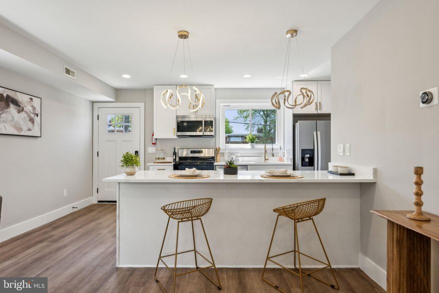 Stunning, Light-Filled Home in a Prime Location... Step into modern sophistication and everyday comfort in this beautifully renovated, light-filled home perfectly situated in a highly sought-after neighborhood. Designed for effortless living and stylish entertaining, this residence showcases a seamless open-concept layout flooded with natural light, complemented by brand-new flooring, fresh designer paint, and sleek recessed lighting throughout.... At the heart of the home lies a true showstopper: a gourmet kitchen built for both form and function. Featuring all-new stainless steel appliances, luxurious quartz countertops, ample custom cabinetry, and a dramatic waterfall island with bar seating, it’s a space that invites both daily gathering and unforgettable entertaining... The thoughtfully designed floor plan offers flexibility and privacy across three distinct levels... This home features four bedrooms and two bathrooms...  Each of the home’s two full bathrooms has been meticulously designed with high-end finishes, including custom tile work, designer lighting, and expansive vanities—creating a serene, spa-like retreat in every space.... Located just minutes from schools, restaurants, and shopping destinations, this home delivers the perfect balance of luxury, location, and livability.... Don’t miss this exceptional opportunity—schedule your private showing today and experience the lifestyle you’ve been dreaming of.