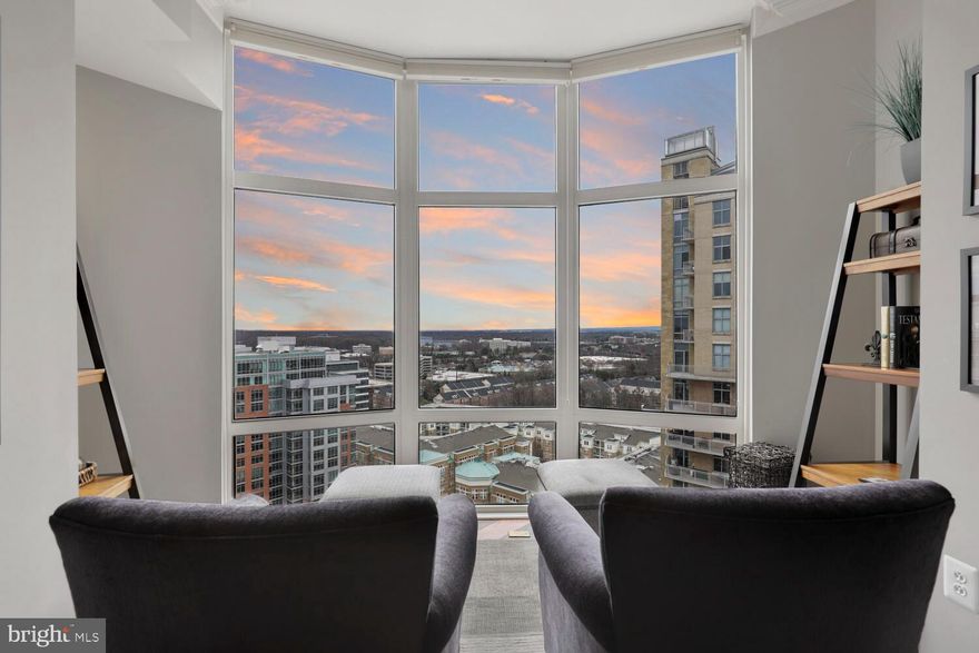 Welcome home to penthouse perfection - luxury living at its finest! Located in the heart of Reston, in the highly desired Midtown at Reston Town Center, this magnificent property boasts breathtaking panoramic views of the Blue Ridge Mountains and sunsets from the 18th floor. Outstanding features of this property include 7" Hickory hardwood flooring throughout the main living areas; 10' ceilings; 3-piece crown molding throughout; private Office with built-ins could also serve as a third Bedroom; beautiful Living Room with a cozy gas fireplace and a sitting nook to take in the views flows seamlessly to the Family Room/Lounge; stunning, gourmet Kitchen renovated in 2016 showcases Quartz counters, Thermador and Zephyr appliances, designer soft close cabinetry, built in pantry, beverage station; a balcony off the Kitchen extends your entertaining space to the outdoors; Primary Bedroom with a walk-in closet with built in shelving is serviced by the Primary Bath with dual sink vanity, walk-in shower, and soaking tub; the second Bedroom hosts a spacious closet and is serviced by the hall Bath. Enjoy the convenience of being close to all your modern day conveniences and amenities in and around Reston Town Center: just a small walk to the W&OD trail to run/walk, a short drive to Dulles International Airport, approx. 2 miles to the Reston-Weihle metro and few short blocks to the new Reston metro that is now open! Community amenities at Midtown include 24/7 concierge, on-site property management, exercise room, party room, library, private movie theatre, catering Kitchen, two Guest Suite, a swimming pool, and a hot tub.  (*Seller is open to selling furniture in unit with the exception of Seller's personal belongings and some artwork that will not convey).