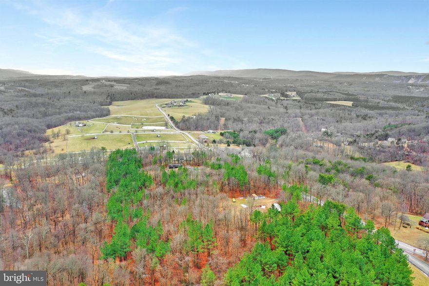 Build your dream home on this 2.42 acres mostly wooded. Unrestricted lot.  Electric near lot. Mt view. Bring your animals. Possible Farmette. Close to hospital, Hagerstown, MD, RT 70, RT9 and downtown Berkeley Springs.