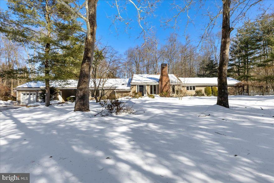 Set on a picturesque 1.38-acre mature lot in Princeton, this striking mid-century modern residence seamlessly blends timeless architectural design with tranquil natural surroundings. Spanning over 3,200 square feet, the home is thoughtfully laid out on a single level, offering an airy, open floor plan that is both functional and inviting. Clean lines, expansive walls of glass, and a strong indoor-outdoor connection define the living spaces.
At the heart of the home, the dramatic family room features soaring cathedral ceilings and floor-to-ceiling windows that flood the interior with natural light while framing serene views of the landscape beyond. The main living areas flow effortlessly to the outdoors, with direct access to the patio from both the living room and kitchen—ideal for entertaining or enjoying peaceful mornings immersed in nature. A welcoming fireplace adds warmth and character upon entry, while a second fireplace anchors a few steps down in an additional TV or gathering room, creating a cozy retreat.
The bedroom wing includes three well-proportioned bedrooms that share a full bathroom, along with a primary suite offering its own en-suite bath and generous closet space. Adding exceptional flexibility, a separate bedroom and full bathroom located behind the two-car garage provide an ideal arrangement for guests, an au pair, or a private home office. A charming breezeway connects the garage to the main residence, enhancing both character and everyday convenience.
Additional features include a whole-house generator for peace of mind and a separate shed offering ample storage for tools, equipment, or hobbies.
Surrounded by established trees and set well back from the road, this home offers privacy, space, and classic mid-century appeal—an exceptional opportunity in one of Princeton’s most desirable settings.
Fireplace and chimney are sold strictly as-is. Square footage is approximate; buyers should perform their own due diligence.