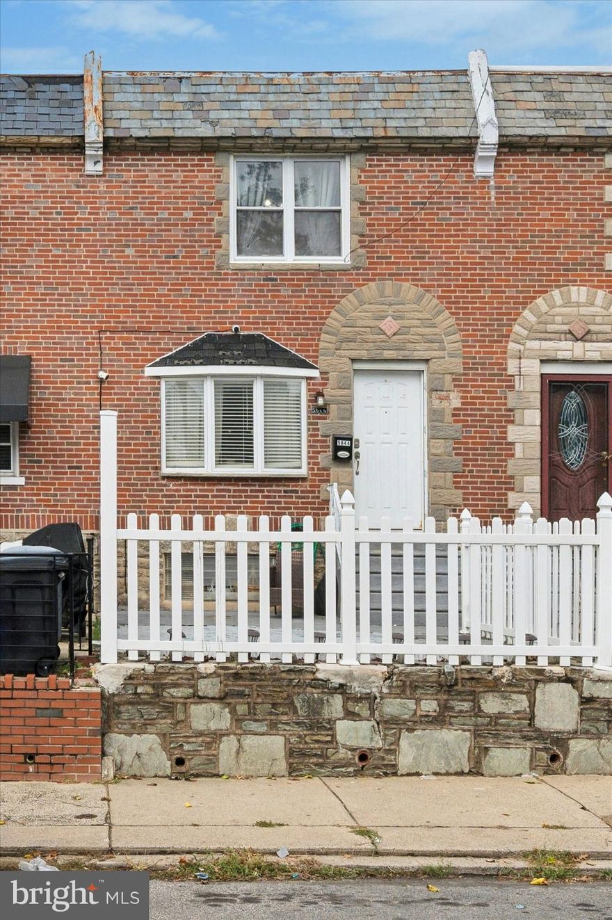 Experience modern living in this beautifully renovated 3-bedroom, 1-bath brick-front row home in Oxford Circle. Step into a contemporary space with newly refinished hardwood floors, an upgraded modern kitchen, and comfortable carpeting in all three upstairs bedrooms. Three bedrooms on the upper level share a conveniently located hall bath. The finished basement offers additional living or entertainment space and comfort with a newer heater and central air. Outside, enjoy a private front patio and the convenience of a fenced-in back driveway leading to a one-car garage with an automatic door opener. This home is ideally located near public transportation and local amenities.