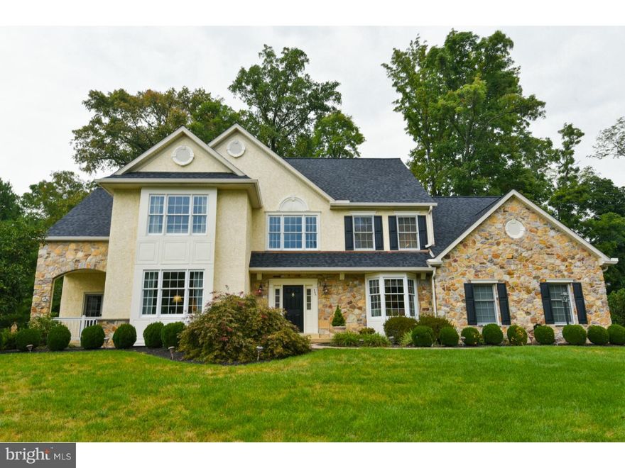 Beautiful home!  Hardwood on first floor, main bedroom and upstairs hallway. Open living room, dining room with window seat, new eat in kitchen with cherry center island, granite counters, tile backsplash, stainless appliances, desk, and door to the oversize deck and a very secluded rear yard,  Family room with stone faced gas fireplace and wet bar, main floor office with custom built-ins, powder room and bumped out laundry room. Main bedroom features his and her walk in closets, a sitting room with closet and a remodeled main bath with his and her marble vanities, Jacuzzi tub and marble shower. There are 4 more bedrooms - 1 with full bath. Bright lower level is stylishly finished with built in center island bar area including a wine cooler, a full bath, storage room and storage closets. There is a 3 car garage, newer roof, gutters, downspouts and skylights among the many upgrades.  Neutral, spacious, updated and in the quiet but very convenient and popular Clocktower Woods. Definitely move in ready and a Home Warranty too.