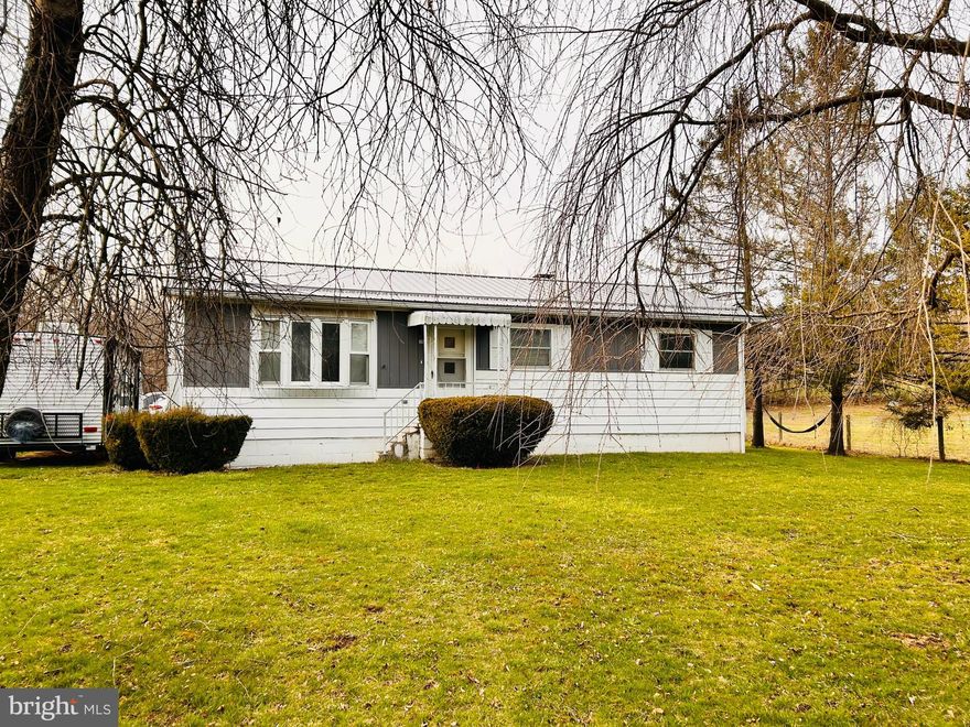 A lot of new in this spectacular ranch home on nearly an acre. Inside enjoy the spacious kitchen/dining area with new granite countertops, new flooring, pantry and plenty of cabinetry. Living room with vaulted ceiling, new flooring and lots of natural light. Basement area is a blank slate ready for your family room, or man cave. New metal roof, new septic 4 years ago, new siding on the garage and nice level yard area for enjoying the outdoors. Located within walking distance of class A trout stream for fishing, close to state game lands, hiking, biking, kayaking, wineries, shopping and grocery stores.