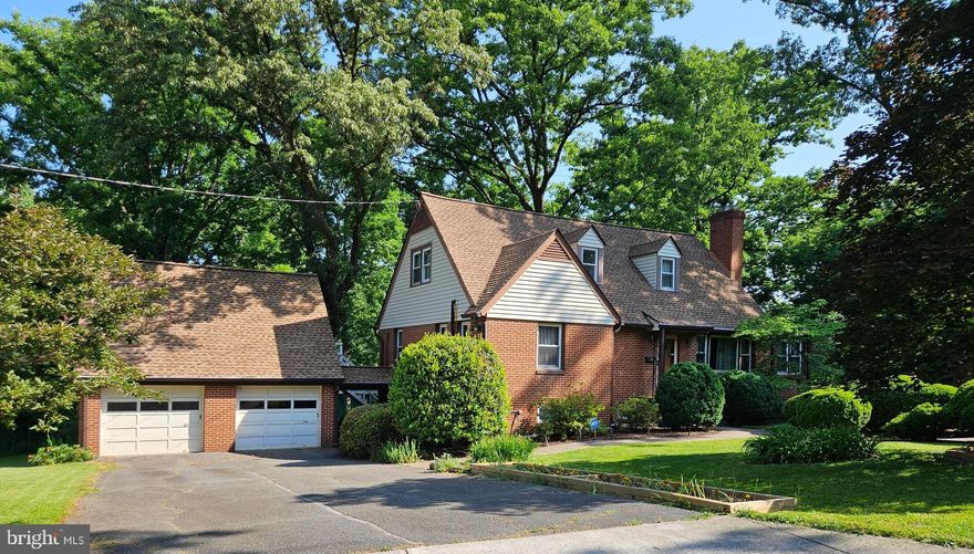 New Price! Charming all brick cape cod with 5 bedrooms on landscaped corner lot within walking distance to UMD. Quiet established neighborhood of well built mid-century homes on good sized lots with lots of mature trees and greenery.  This three level home offers bedrooms on every floor, original hardwood floors through out, two brick fireplaces, an additional music room/sitting room on the main level, central A/C, replacement double pane windows, Architectural shingle roof, gutter guard system, over-sized detached garage with upstairs game room, walk out basement and all situated on a just under a third of an acre corner lot. Seller Prefers to sell "AS IS".