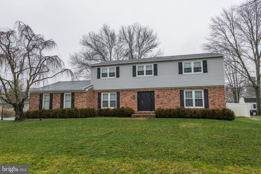 Welcome to this 5 bedroom home in the desirable Queens Grant neighborhood of Yardley. With versatile living space and beautiful hardwood flooring, this home offers the perfect combination of charm and modern luxury. Step inside through the NEW front door where you will immediately notice the upgraded trimwork and neutral colors throughout. On your right, through French doors, is your cozy living room with windows to allow for radiant sunshine and on your left, entertain friends and family in style in your formal dining room boasting NEW carpet, unique chandelier and enhanced moldings. Continue down the hallway to your stunning eat in kitchen featuring granite countertops, tile backsplash, pendant and recessed lighting, oversized island allowing for ample counter and cabinet space, stainless steel appliances, pantry closet and separate eating area with ceiling fan. Conveniently located off the kitchen is your spacious family room, perfect for social gatherings, showcasing a white washed brick accent wall with fireplace, ceiling fan and NEW sliding doors with in-glass blinds allowing access to your screened in porch. Located on the opposite side of the kitchen is a bonus room, ideal for an office, 5th bedroom or additional playroom on the first floor!    A laundry room complete with cabinetry for storage and direct access to your backyard and a recently renovated powder room complete this floor. Upstairs has four additional spacious bedrooms complete with carpeting, ceiling fans and windows for natural light. The primary bedroom boasts a California closet and beautifully updated luxurious ensuite full bathroom showcasing an oversized tiled stall shower with glass doors and built-in bench, dual sink vanity and beautiful cabinetry for all your storage needs. The full hallway bathroom is also updated to perfection featuring a tub shower combo, dual sink vanity and ample cabinetry. This home boasts a fully refinished basement (2021) featuring NEW carpet, recessed lighting, French drain, dehumidifier, 2 sump pumps and versatile space for all your needs. There is also a separate room ideal for a fitness room or extra storage! Your fully fenced in backyard offers a private escape featuring a screened in porch to enjoy all seasons, a paver patio AND a deck and is perfect to enjoy outdoor activities. Other recent upgrades include a NEW roof (2023), NEW gutters, NEW vinyl privacy fence and a NEW dishwasher!  The home also has a gas generator which can be hooked up to the electric panel!   Located near Route 1 and I-295 for easy commuting and close to a variety of shopping and restaurants. Pennsbury school district too! Don’t miss the opportunity to see this beautiful home! **Seller is also including a one year home warranty to the future buyer**