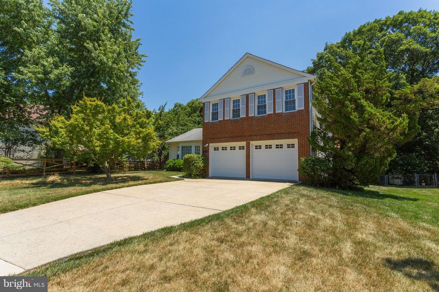 Lovely home on large level fenced lot. Large colonial on three levels with approx. 2246 SF on upper levels.  Partially finished basement w/ full bath. Large deck accessed through family room. Four large bedrooms on upper level with two baths. Half bath on main level. Large family room w/ fireplace and wood floors. Updated kitchen with marble counters and tile floor. Just painted and new carpet