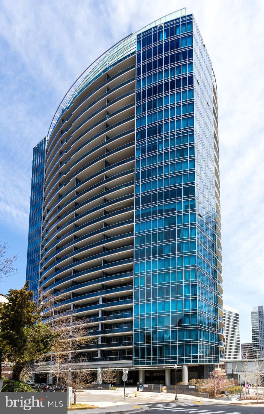 Luxury 1BR + Den/2BA Turnberry Tower Condo in the Heart of Rosslyn. Private elevator & Dedicated Garage space P4-03. Many other units only have valet parking which has limited availability. Garage space value est $60K. 1642 sq ft of living space & expansive covered terrace. Floor to ceiling windows w/ commanding city views. Gourmet kitchen w/ Subzero, Miele, Snaidero cabinets, peninsula bar. Den makes a great home office or flex space. 24 hr concierge, indoor pool, spa, state of the art fitness center, complimentary valet parking for residents & guests. 1 private storage unit conveys (BS1-16). Blocks to Rosslyn Metro & Georgetown!