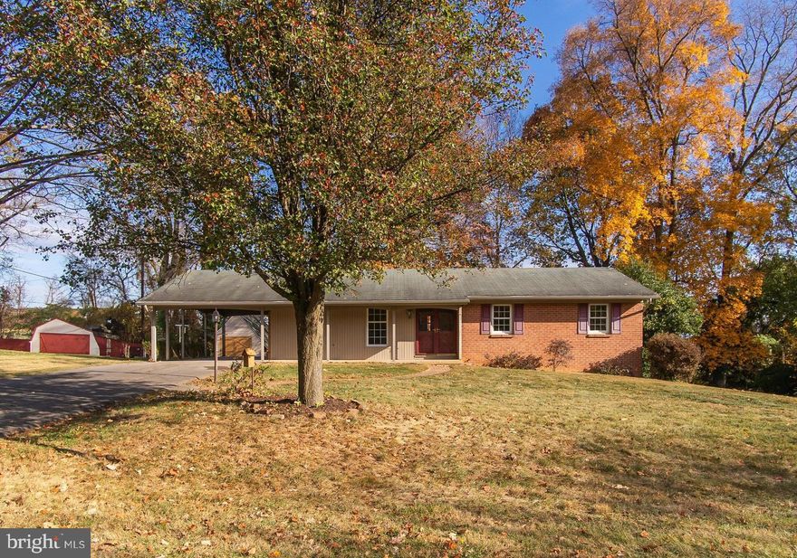 ONE OWNER HOME! Custom built rancher tucked away on a quiet, non thru street and backing to farmland!! Main level features a charming foyer with brick flooring, large living room with oversize windows, GORGEOUS kitchen with soft close cherry cabinetry, quartz countertops, tile backsplash & flooring. Kitchen opens directly into the dining room with wood beams on the ceiling and a brick fireplace feature wall. Glass french doors open up into the rear family room addition that you will LOVE-SO much natural light, 2 doors to the exterior + a 2nd cozy gas fireplace! 3 BDRMS &  2 renovated full bathrooms round out this main level. Full basement that could be updated for addtl living space + a large storage/utility/laundry room with door to exterior.  2 car attached carport, front porch, rear deck & large storage shed. Cushwa brick exterior. All of this on a beautiful .45 acre lot in prime location that is just minutes to I70 & I81, shops, dining, schools (Fountain Rock, Springfield & Williamsport), C&O Canal, Potomac River & SO much more!! NO city taxes & NO HOA!
