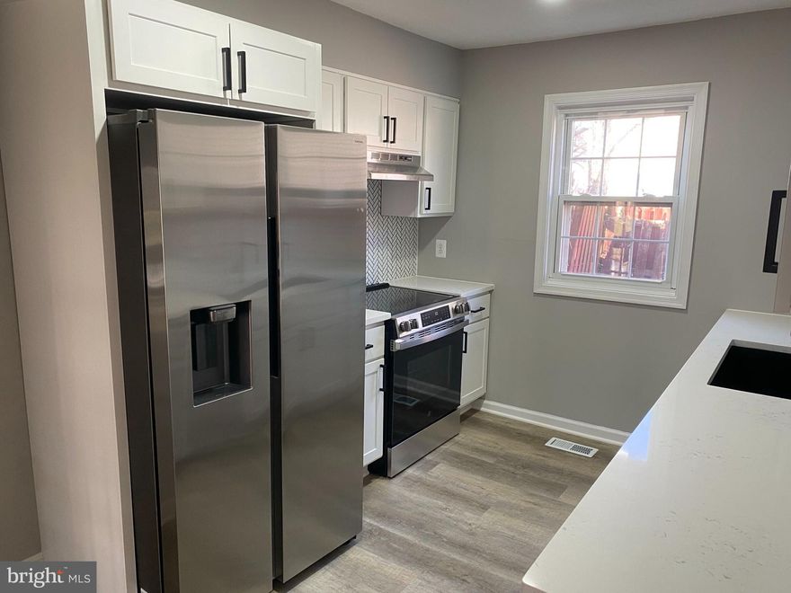 Stunning Renovated Brick-Front Three-Level Townhouse offering Modern Style and Exceptional Comfort. The Updated Kitchen Showcases QUARTZ Countertops, Designer Tile Backsplash, and Stainless Steel Appliances, ideal for Everyday Living and Entertaining. Renovated Bathrooms, New Flooring, New Lighting, and New Custom Paint create a Fresh, Contemporary Feel Throughout. Enjoy Outdoor Living with a Private Deck and a Fully Fenced Backyard, Perfect for Relaxing or Hosting Guests. A Truly Move-In Ready Home that Combines Quality Upgrades with Timeless Appeal.  Hurry This Will Not Last!