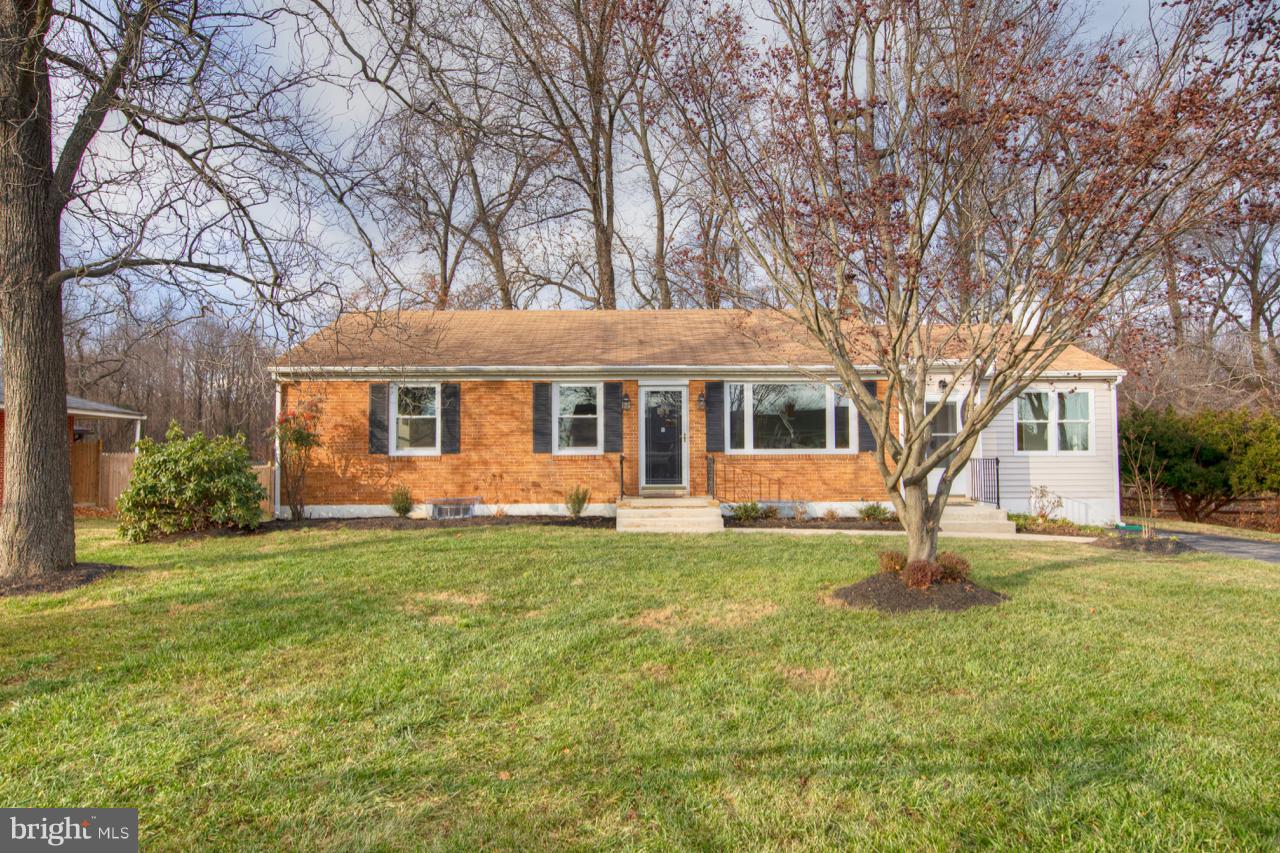 Stunning completely remodeled brick front rancher with over 2100 sq ft of living space! Featuring 3 bedrooms, 2 1/2 baths & finished lower level with Family Room. Beautifully remodeled eat-in kitchen with new counters, back splash, and stainless steel appliances. Living Room with wood burning fireplace, shiplap wall & custom mantel. Dining Room with beautiful hardwood floors and barn slider doors. Completely remodeled baths. Extra large lower level family room, fresh paint throughout & new flooring. Private rear yard backing to trees with patio and updated landscaping. Brand new HVAC, windows, hot water heater & so much more. Completely move in ready! This home is a 10+