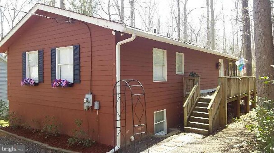 Open and airy  floor plan with full basement!  Country kitchen open to family room.   2 Sets of French doors leading to large screened in deck. Huge family room with wood stove and rock surround. Big laundry room. Concrete patio off lower level.  Basement has separate entrance and can be used as apt/in law suite with addition of 3rd bathroom (existing rough-in for plumbing)