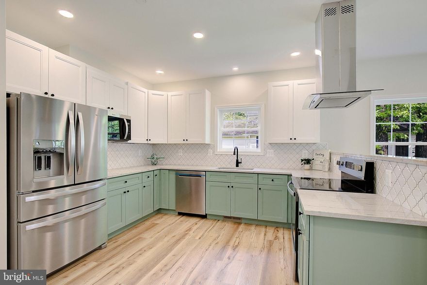 LUXURY LIVING BY THE BAY | NEW CONSTRUCTION | RARE DOUBLE LOT

This stunning brand new home in the coveted North Beach community offers the perfect blend of luxury, comfort, and coastal living just four blocks from the waterfront! Boasting over 2,700 square feet of finished living space, this exquisite 4–5 bedroom, 4.5 bathroom residence is designed with high-end taste and modern functionality in mind.

Step inside and immediately notice the soaring 9-foot ceilings, luxury vinyl plank flooring, and a beautifully crafted open layout that flows effortlessly between spaces. From the gleaming quartz countertops to the stainless steel appliances, every detail has been thoughtfully selected to elevate your lifestyle.

The upper level showcases a lavish primary suite retreat complete with a spa like bathroom, walk-in shower, and standalone soaking tub. Two additional bedrooms, a full bath, and a versatile bonus room ideal for a home office, playroom, or lounge complete the upper floor.

On the main level, a second primary suite offers flexibility for guests or multi generational living. A welcoming front porch and expansive rear deck make entertaining a breeze, while the EV charger, two laundry rooms, and two car driveway add convenience rarely found in North Beach.

The partially finished basement provides bonus space perfect for a fifth bedroom, gym, or media room tailor it to fit your lifestyle. Also offers a full bathroom and a walkout basement to the nice lush back yard and patio. 

Set on a rare double lot, this home provides privacy and space while still being walkable to the boardwalk, beach, shops, restaurants, breweries, and more. North Beach offers small town charm with year round events, farmers markets, and vibrant community gatherings all just a short drive from DC, Baltimore, and Annapolis.

100% Financing Available | No HOA | Owners are Licensed Realtors in Maryland

📍 Don’t miss the video walk-through tour included in the listing.

This is your chance to own an exceptional, move-in ready home in one of the most desirable beach communities in Maryland. Schedule your private tour today. INVESTORS This would make a great vacation rental and is allowed with permission from the town. Professional property management available.