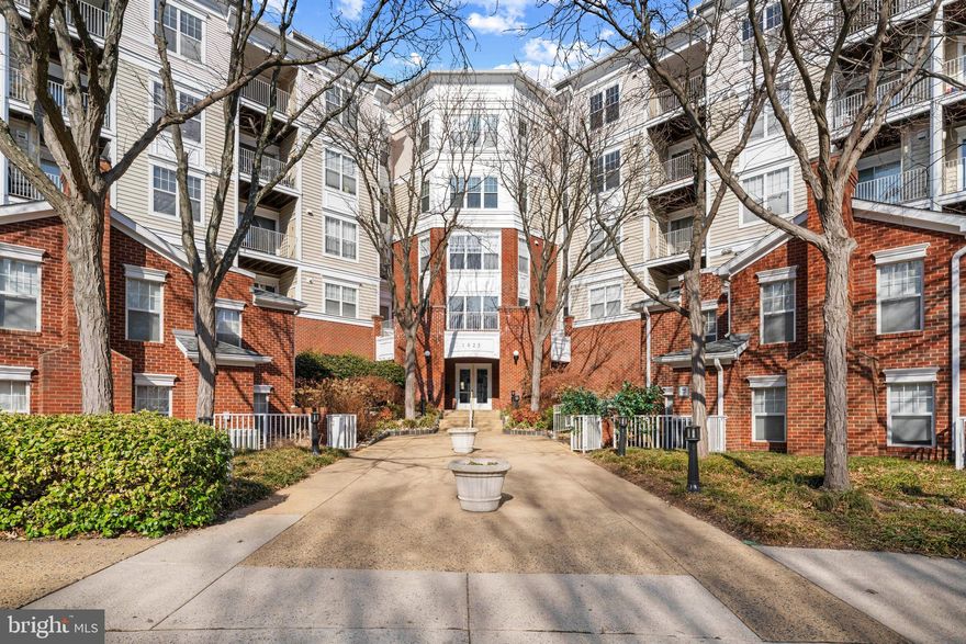 LIGHT & BRIGHT  3rd floor unit featuring hardwood floors, cozy gas fireplace, spacious primary suite with walk-in closet, generous bathroom and dual access to the private balcony****Freshly painted and new lighting throughout****Washer & Dryer in Unit****Outdoor Pool ****WONDERFUL LOCATION Next to TYSONS II ****Easy access to Metro, shopping, restaurants, DC & MD.