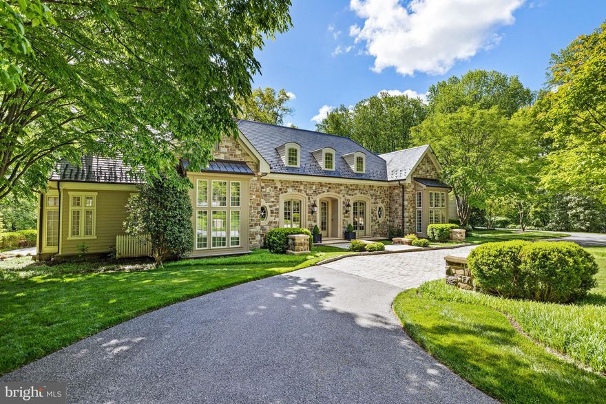 Stunning custom designed luxury home in the prestigious Caves Valley Golf Course Community. This gracious and elegant home provides 11,000 square feet of exquisitely appointed living spaces. Enter through the Grand Foyer that flows into the Great Room with custom built-ins, soaring ceilings, fireplace and walls of windows to bring the beauty of the outside in. The Gourmet Kitchen boasts premium appliances, granite counters, oversized center island, breakfast area & walk-in pantry. The Butler's pantry is located off the kitchen and allows for entertaining prep for the  intimate Dining Room which is set apart from the main area. The main level Primary Suite provides a luxurious spa like bath, custom dressing room, laundry closet and access to the screen porch. The Library offers walls of custom built-ins and a cozy sitting area. The 2nd level provides a comfy family room & 4 generous en-suite bedrooms. The thoughtfully designed lower level is an entertainer's dream with the full pub bar, wine cellar, billiard -game area and custom entertainment center. The lower level  also includes craft room, exercise room, full bath and plenty of storage . The private  well manicured  2.06 acre lot  is decorated with a lush variety of trees, shrubs  and an expansive bluestone terrace which overlooks the 16th hole at Caves Valley.  Welcome to "The Residences of Caves Valley" .