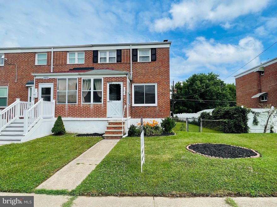 Welcome home! This lovely end of group rowhome welcomes you with an enclosed porch, home which has been freshly painted, and has hardwood floors throughout. Three generously sized bedrooms with a full bath on the upper level, and finished lower level, with laundry and a pellet stove for those cooler nights. The screened-in porch will invite you to sit outside and enjoy the flat back yard. Out back, there is a large shed, and carport for your car, or for a table which friends and family can sit around.  Plenty of parking on the street or the alley out back. The owner has made a lot of updates for you, so come see how we can make this your home!