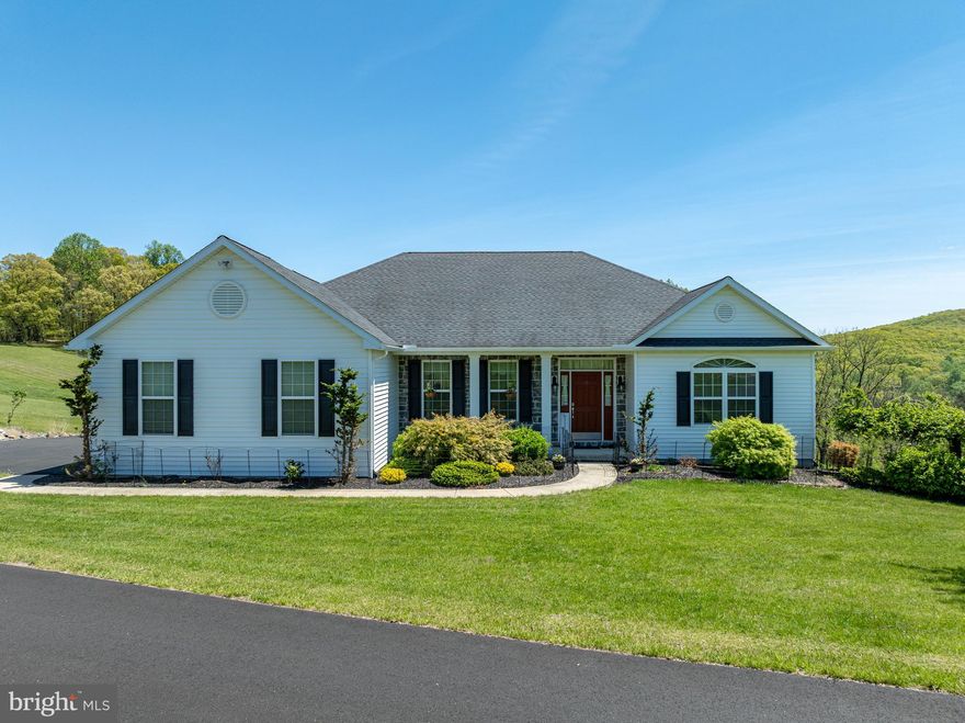 This amazing Greth built Rancher sits on a large picturesque lot with views of Woods and Fields. The Spacious Open Floor Plan features a Great Room with gas Fireplace and a custom kitchen with Island, Granite Tops, Stainless Appliances and huge Pantry. Enjoy beautiful Wood Floors and Tile in the Kitchen. The Home Office with gas Fireplace is currently being used as a bedroom. The Split Plan has the Primary Bedroom with Bath & Walk-in on one side and 2 bedrooms and Hall bath off the Great Room. Sliders off the Breakfast area lead to a large elevated deck to enjoy the view. The Laundry off the kitchen leads to the Garage and side entry. The Lower Level includes a full In-Law Suite with Sliders to a patio, Storage, and a huge Workshop with all the electric and work benches a person could want. Come tour this lovingly care for home today.