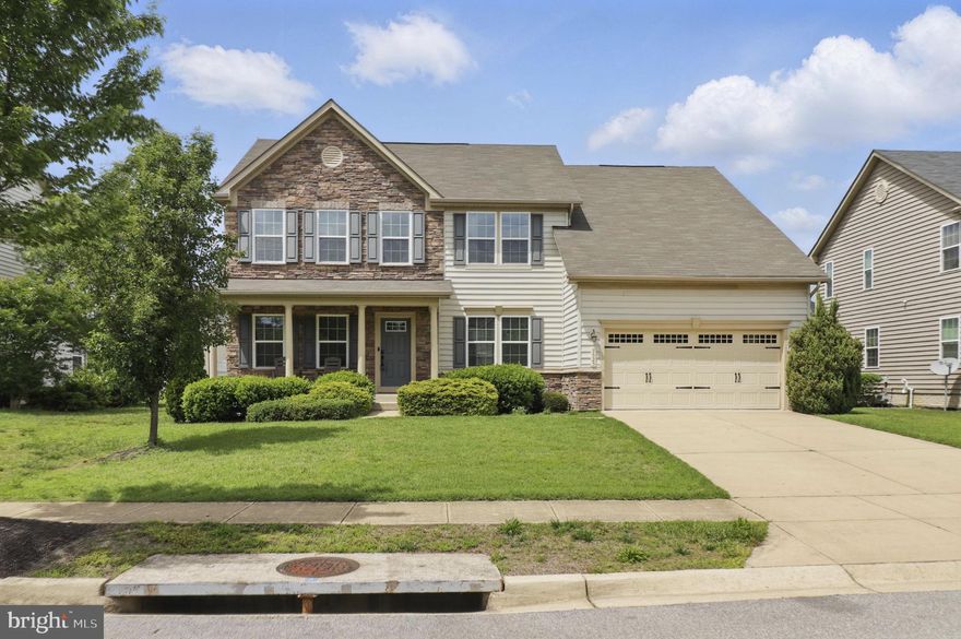 Price Adjustment! This beautifully maintained 4-bedroom colonial blends classic charm with modern comfort. The grand foyer leads to elegant formal living and dining rooms, while the rear of the home opens to a spacious family room with a gas fireplace and a gourmet kitchen featuring upgraded cabinetry, stainless steel appliances, granite countertops, and a large island—perfect for entertaining. A bright breakfast nook, home office, and half bath complete the main level. Upstairs, the owner’s suite boasts vaulted ceilings, a spa-like ensuite with a soaking tub, separate shower, dual sinks, and walk-in closet, along with three additional bedrooms, a full bath, and an upper-level laundry room. The finished lower level offers endless possibilities for a home theater, gym, or recreation space, while the private fenced backyard and two-car garage provide room to grow. Conveniently located near major commuter routes, shopping, dining, and entertainment—your dream home awaits! Some interior photos have been virtually staged.