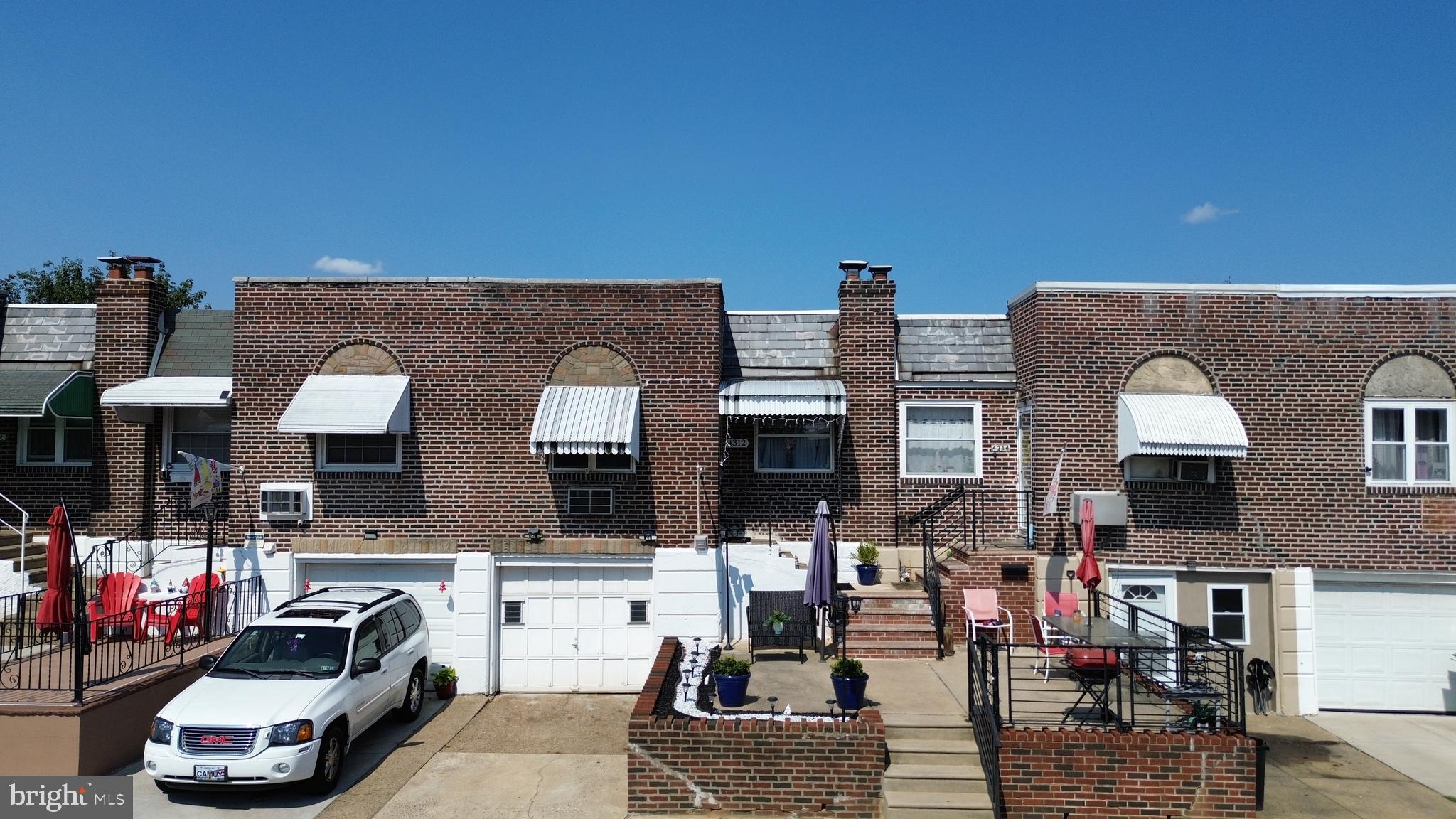Welcome to this charming 2-bedroom, 1-bathroom brick row home located in Juniata neighborhood. Built in 1950 and offering 720 sq ft of cozy living space, this home features a blend of modern upgrades and classic charm.
Step into a bright living room with updated flooring and neutral tones that flow seamlessly into the stylish kitchen, boasting gray cabinetry, granite-style counters, stainless steel appliances, and a timeless black-and-white tiled floor. The main bedroom offers a serene retreat with soft lighting, while the second bedroom is perfect for guests, kids, or a home office setup. The full bathroom maintains vintage character with tiled walls and a functional layout.
The fully finished basement has been transformed into a versatile entertainment space complete with a bar area, lounge seating, dartboard, and mounted TV—perfect for movie nights or hosting friends. Outside, enjoy the beautifully designed covered patio, ideal for relaxing or entertaining year-round. The private yard features a charming garden bed, decorative lighting, and multiple seating areas.
Additional highlights include a front driveway with garage, newer roofing, and close proximity to shopping, schools, and public transportation. Whether you're a first-time homebuyer or looking to downsize, this well-maintained property is move-in ready and full of warmth.
Don’t miss your chance to make this move-in-ready home yours.