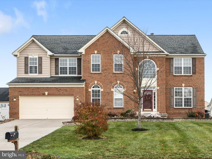 Discover the perfect blend of elegance and comfort in this stunning brick-front Colonial located on a .48 acre prime level corner lot in sought-after Musket Ridge/The Guards. The beautifully landscaped yard creates a stunning first impression, adding incredible curb appeal to this lovely home.  Offering 5 bedrooms, 4.5 baths, and a finished basement, this home is designed to impress from the moment you step inside.  

The main level features beautiful hardwood flooring throughout, a spacious family room with a cozy fireplace, and a private office with glass doors—ideal for working from home. The gourmet kitchen is a chef’s dream, complete with a large island, double ovens, a gas cooktop, newer refrigerator and dishwasher, ample cabinetry, and generous counter space. Entertain in the formal dining room adorned with crown molding or enjoy casual gatherings in the open-concept living spaces.

Upstairs, an inviting loft provides extra room for relaxation or play. Double doors lead to a luxurious primary suite with a spa-like bath featuring a soaking tub, tiled shower, dual-sink vanity, separate water closet, and walk-in closets. The second bedroom boasts an ensuite bath, while the third and fourth bedrooms share a well-appointed hall bath. Convenient bedroom-level laundry completes this floor.

The finished basement offers exceptional versatility with a spacious family room, additional bedroom, full bath, and private living area—perfect for guests or extended family.

The oversized 2-car garage offers plenty of extra storage space, perfect for tools, equipment, or hobbies. The large driveway provides ample additional parking, making it convenient for guests or multiple vehicles.

Outside, enjoy serene outdoor living on the screened porch or step onto the custom stamped concrete patio, perfect for entertaining or simply unwinding. The large corner lot, facing a peaceful cul-de-sac with no through traffic, offers privacy and plenty of space to play and relax.

This home has everything you need—inside and out—to live comfortably and entertain in style. Don't miss this incredible opportunity to own a dream home in one of Stephens City’s most desirable neighborhoods!