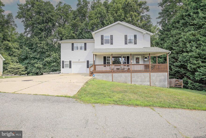 This is the perfect house in the perfect location! Owings address with easy access to the North Beach attractions and restaurants! No HOA and located on .5 of an acre this large Colonial will not last long!!!  Offering to a new buyer this 4 bedroom 2.5 bath home which features really nice sized bedrooms, large bathrooms, and an open floor plan on the main level.  The inviting front porch is nice to sip your morning coffee while listening to the birds sing. Step inside to be delighted with the wood floors, open concept and open space. The large family room and kitchen space are perfect for gathering's of friend's, family and everyday.  The large kitchen with a ton of counter space, nice wood cabinets and newer stainless steel appliances are a nice touch.  Step upstairs and you will begin to discover that these rooms are not your average size and the closet space is equally a large! Want a laundry room on the upper level? Well here you go and it is not tiny either!  The Primary bedroom offers a large bathroom with a tile shower, soaking tub and vanity along with a linen closet. The bedroom offers 2 large closets and a nice sitting area.  The finished basement is the perfect place for the kiddos to hang out or the adults and make it any kind of cave you desire! With some storage in a smaller room or finish it off for more space. The walk out level is great for the fully fenced back yard and the trees make this yard not only private it offers a good amount of shade for the hot summer days.  The home has a new HVAC unit, Water softener system and well pump.  Seller needs to find home of choice.  This one is a great purchase and great location!