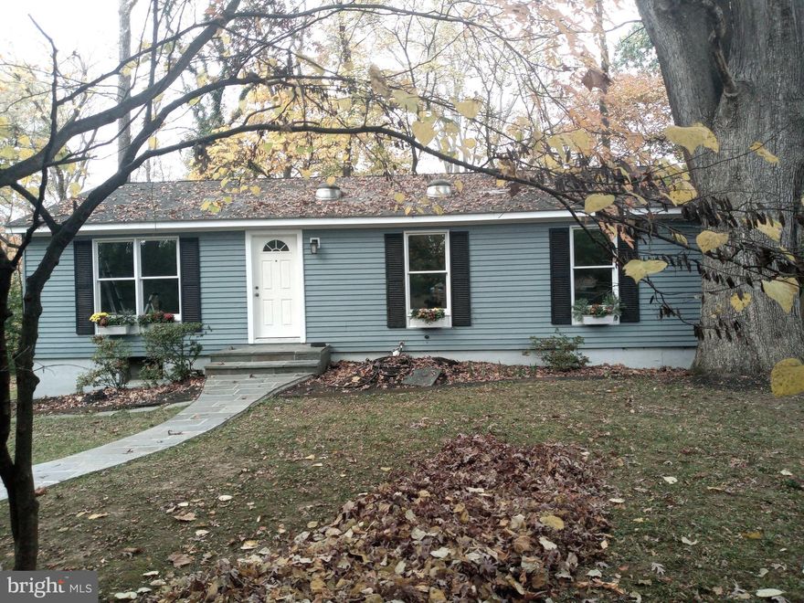 Here's the best of both worlds ! If you want to live “in the country” - a private, wooded environment (embedded in Rock Creek Park); yet you want the convenience of a walkable, bikeable town, this 3 BR rambler fills that need!   It is ocated in historic Kensington, in the friendly community of Ken-Gar. This house has been well maintained and freshly renovated inside and out. There is new flooring, and new plumbing and heating fixtures. The tablespace kitchen has been updated with a new dishwasher, disposal, sink, countertops, and tile backsplash; and has a seller credit of $1500 for a new refrigerator. Bathroom has been completely renovated with porcelain tile walls and floor, and new tub, vanity, and mirrored 3-door medicine cabinet. It has new luxury vinyl plank flooring in the living room, kitchen, hallway and one bedroom. You will appreciate, energy-wise, the six tubular skylights shedding beautiful natural light into the kitchen, bath, 2 bedrooms, and lower-level stairwell; and the natural cooling effect of the forest and surrounding trees. A sliding door in the kitchen opens to a newly updated, private rear deck with a vista of the park’s flora and fauna. The unfinished lower level is waiting for your design.