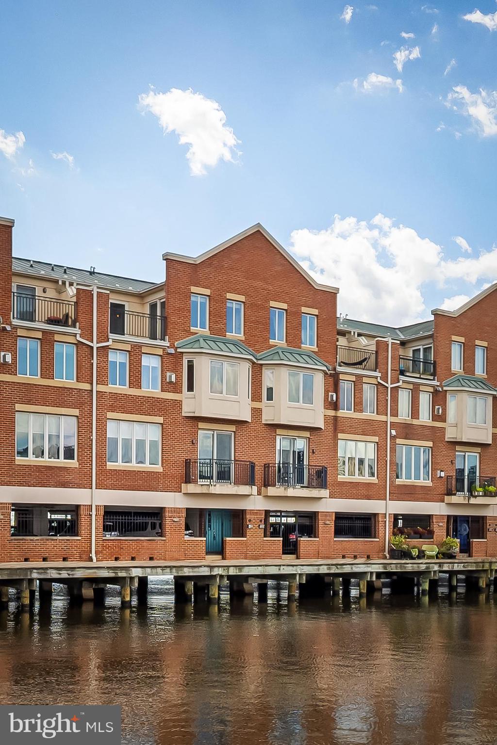 Rarely available pier townhome in the heart of Canton. This home has so much to offer – the main floor has an open floor plan, gourmet kitchen with Viking stove, separate pantry, powder room and balcony. The floor above has the primary suite with huge walk-in closet, luxury bathroom, fireplace, and separate laundry facilities. The top floor has a large bedroom that can be broken up into separate sleeping and sitting areas, another large full bathroom, plus a generously sized deck with stunning views of Canton and Fells Point. The entry level offers 2 reserved parking spaces that are right next to your front door, plus a utility closet with yet more storage. So, if you like chic waterfront living, then you will love this Zen home.
