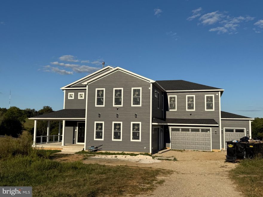 Nestled on a sprawling 1.41-acre lot, this exquisite new construction residence is a testament to luxury living, offering an unparalleled blend of comfort and sophistication. With six spacious bedrooms and two and a half elegantly designed bathrooms, this home is perfect for those who appreciate both style and functionality. Step inside to discover a thoughtfully crafted interior that boasts high-end finishes and modern conveniences. The heart of the home features a gourmet kitchen equipped with a six-burner stove, built-in range, and a sleek built-in microwave, making it a culinary enthusiast's dream. The living spaces are adorned with rich hardwood flooring and luxury vinyl tile, providing a warm and inviting atmosphere. Cozy up by one of the four fireplaces, each designed to enhance the ambiance of your home. The main level also features a convenient central vacuum system and an air filter system, ensuring a clean and comfortable environment year-round. Retreat to the master suite, where relaxation awaits. The luxurious bathroom features a jetted tub, a walk-in shower, and a stall shower, creating a spa-like experience right at home. Each additional bedroom offers ample space and natural light, making them perfect for guests or a home office. This residence is designed with modern living in mind, featuring an elevator for easy access to all levels and a dedicated laundry area conveniently located on the upper floor. The property also includes a high-efficiency water heater, ensuring energy savings without compromising comfort. Step outside to your personal oasis, complete with a private pool that invites you to unwind and enjoy the outdoors. The expansive outdoor space is perfect for entertaining or simply enjoying the tranquility of nature. With an attached garage that accommodates up to five vehicles and additional driveway space for four, parking is never a concern. The side and front entry garage design adds to the home's curb appeal, making a striking first impression. This property is not just a home; it's a lifestyle. Experience the perfect blend of luxury, comfort, and modern convenience in this stunning new construction. Embrace the opportunity to make this exceptional residence your own, where every detail has been meticulously considered for your enjoyment.