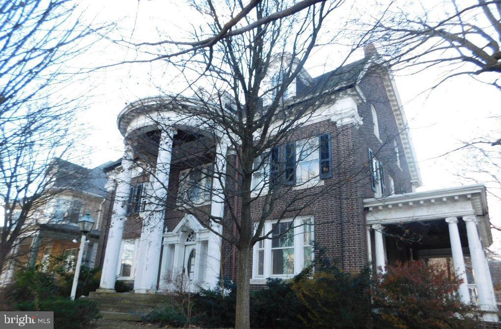 HUGE 3 STORY COLONIAL HOME WITH 9 BEDROOMS, 4.5 BATHROOMS, HARDWOOD FLOORS, 2 FIREPLACES, HIGH CEILINGS, 1 CAR DETACHED GARAGE, ETC.