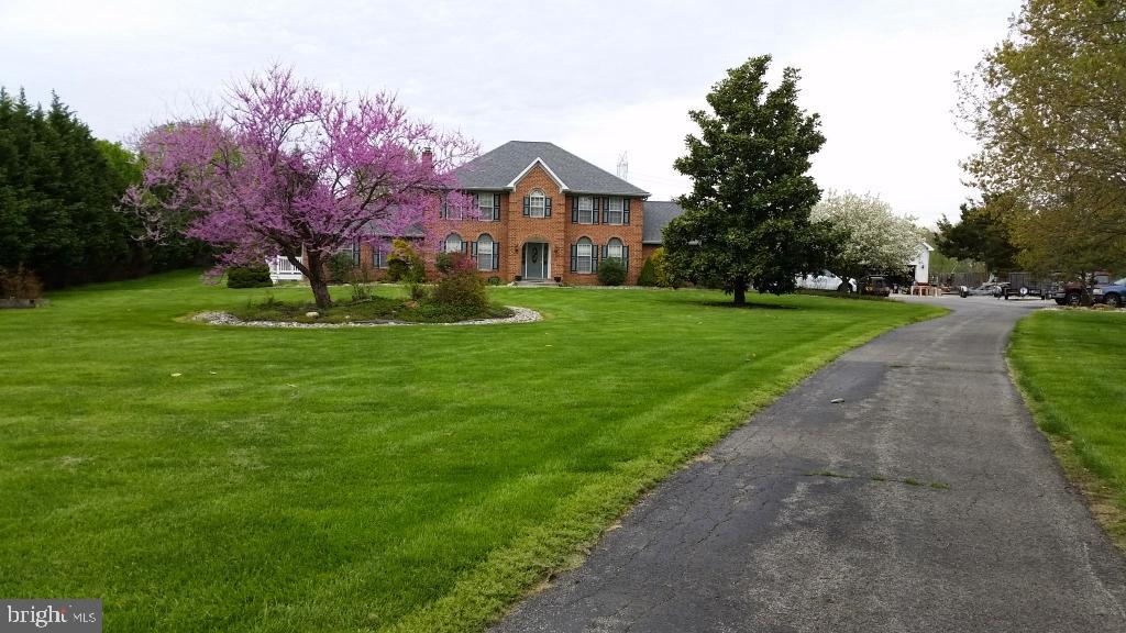 6 BEDROOMS, 3.5 BATH COLONIAL, HOME IS ON 2.86 ACRES WITH LONG SWEEPING DRIVEWAY, GOURMET KITCHEN WITH GRANITE COUNTER TOPS AND CABINETRY, LOCATED IN WOODMORE MEADOWS, ADJOINING FAMILY ROOM WITH A BRICK FIREPLACE, SEPARATE DINING ROOM, OFFICE, AND LIVING ROOM . FINISHED BASEMENT WITH ONE BEDROOM AND ONE FULL BATH, TWO CAR GARAGE, COVERED PORCH WITH TWO IPE DECKS ON BOTH SIDES..
THERE IS AN ADDITIONAL SEPARATE GARAGE WITH AN IN-LAW APARTMENT ON THE SECOND FLOOR, WITH A KITCHEN AND FULL BATH. THERE IS A HALF BATH WITH A LARGE SINK, AND A WASHER AND DRYER ON THE FIRST LEVEL
MAIN HOME HAS CEILING FANS, CHAIR RAILINGS, CROWN MOLDING . WHIRLPOOL TUB, BUILT-IN MICROWAVE, AND RANGE WITH COOKTOP.