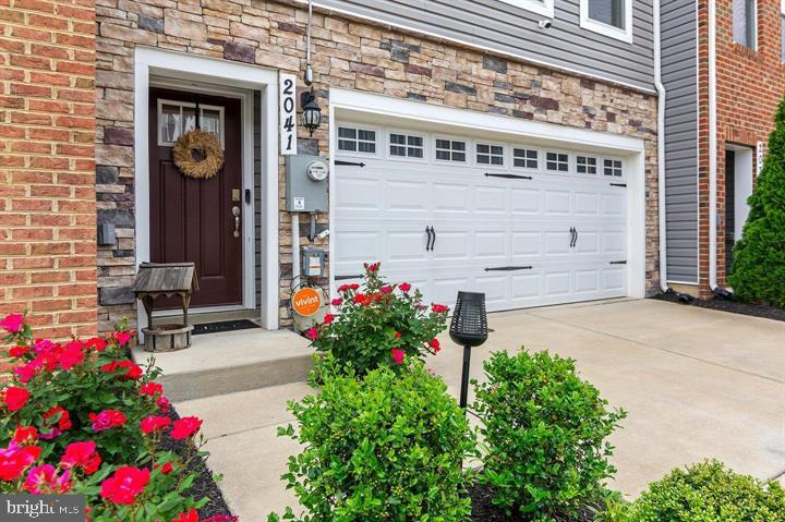 MOTIVATED SELLERS!!
*** SOLAR PANELS CONVEY WITH THIS PROPERTY FREE AND CLEAR, NO FEES INCLUDED*** Welcome to 2041 Ruby Turn, a stunning four-bedroom, three-and-a-half-bath townhome nestled in the sought-after Woodmore Overlook Community. Built in 2020, this meticulously maintained 2,872 square-foot residence seamlessly blends modern design with everyday comfort, offering an exceptional living experience. Upon entering, you're greeted by an open-concept main level adorned with luxury vinyl plank flooring that flow effortlessly through the spacious living and dining areas. The gourmet kitchen is a chef's dream, featuring stainless steel appliances, a five-burner gas range, granite countertops, and a large center island perfect for meal preparation and casual dining. Adjacent to the kitchen, a 12x10 deck provides an ideal space for outdoor entertaining or relaxing with a morning coffee. The upper level boasts a luxurious owner's suite complete with a generous walk-in closet and an en-suite bathroom featuring dual vanities and a walk-in tile shower. Two additional well-appointed bedrooms, a full bathroom, and a conveniently located laundry room complete this level, ensuring comfort and functionality for the entire family. The fully finished lower level offers a versatile space that can serve as a fourth bedroom, home office, or recreation room, complete with a full bathroom and ample storage. Additional features include a two-car attached garage, EV charger for your vehicle, smart home technology with keyless entry, a video doorbell, and a programmable thermostat, enhancing both security and convenience. Situated just minutes from the Woodmore Towne Centre, residents enjoy easy access to shopping, dining, and entertainment options, including Wegmans, Costco, and Best Buy. With close proximity to major commuter routes such as Route 202, I-495, and Route 50, this home offers both luxury and location. Don't miss the opportunity to make this exceptional property your new home. 2041 Ruby Turn is a perfect blend of style, comfort, and convenience.
